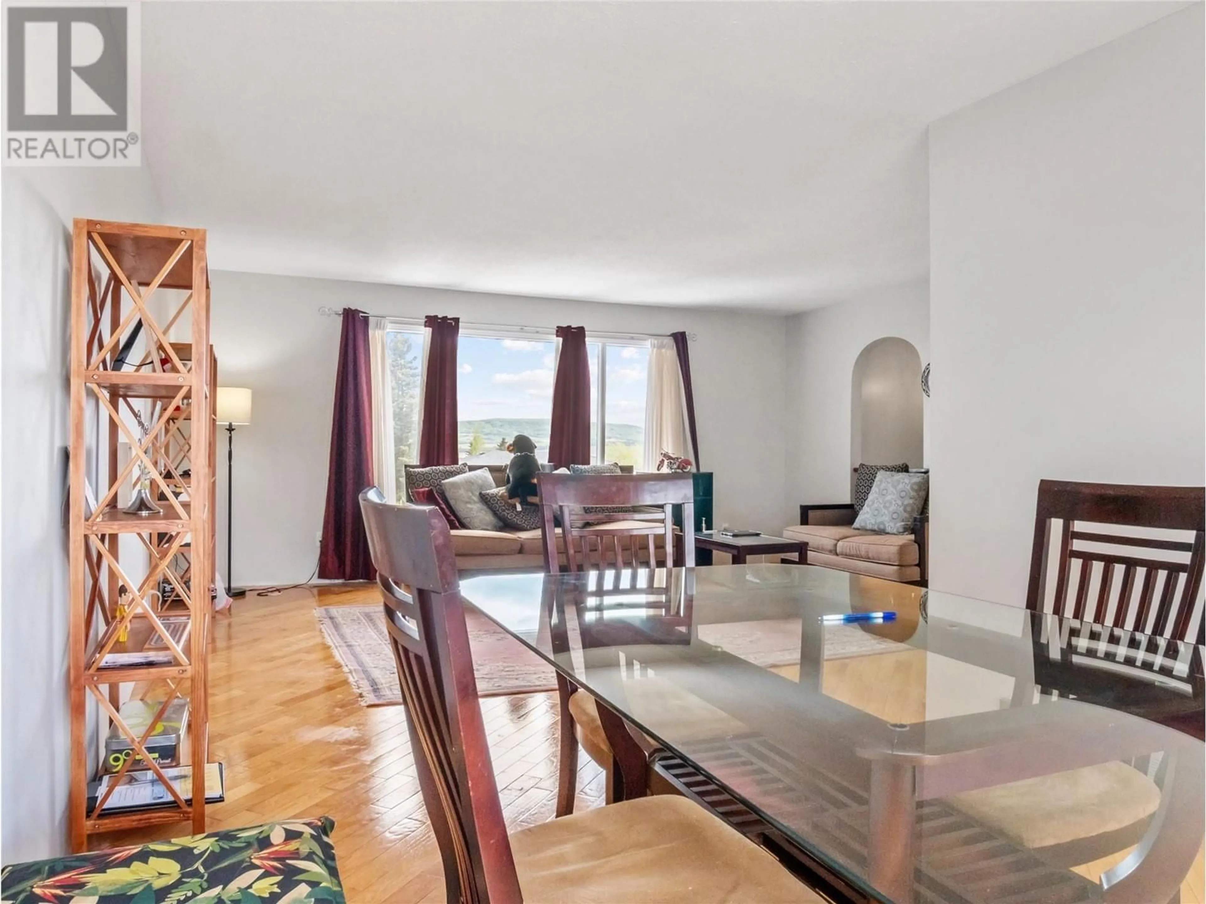 Dining room, wood/laminate floor for 704 96A AVENUE, Dawson Creek British Columbia V1G1M7