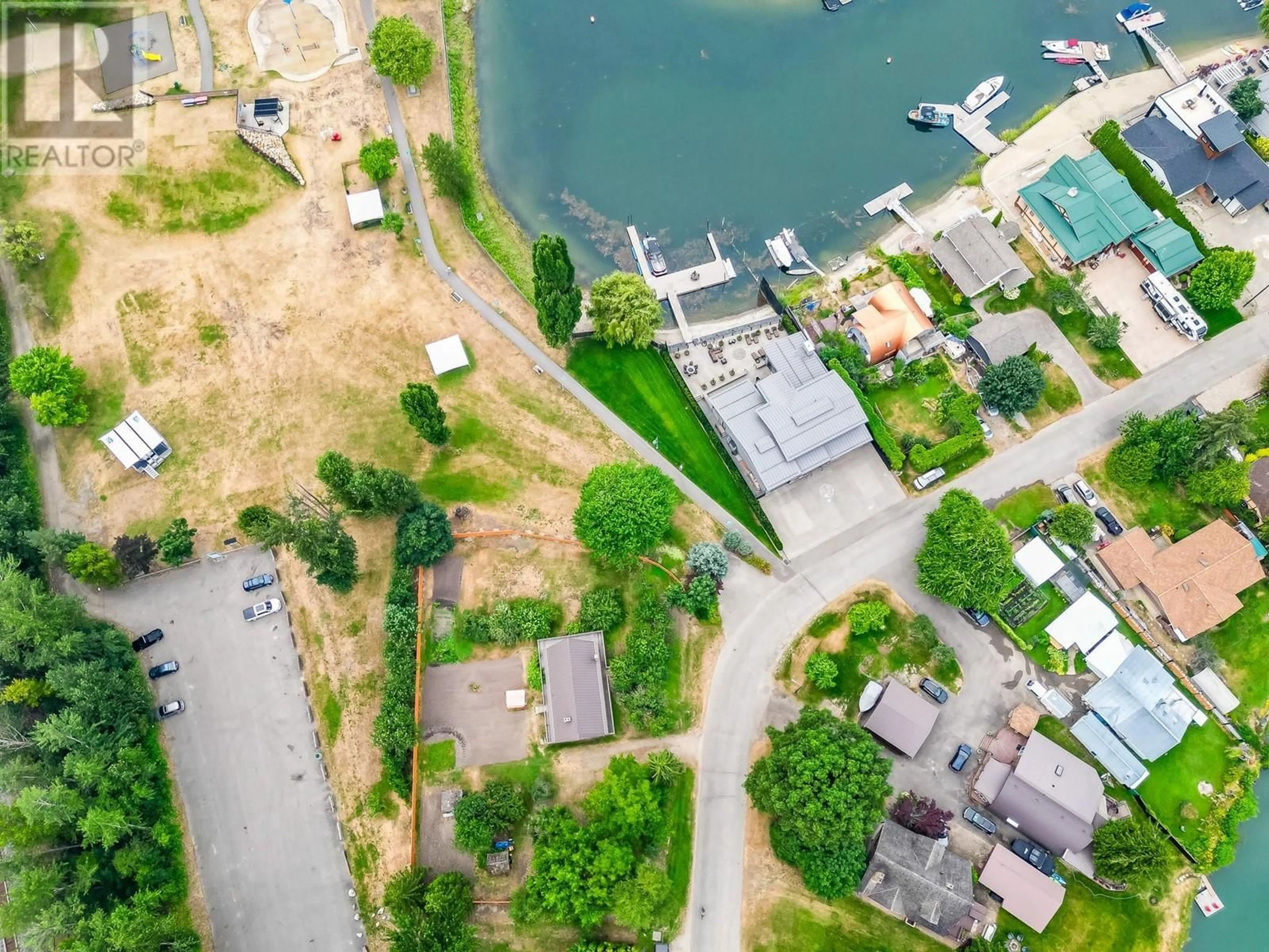 A pic from outside/outdoor area/front of a property/back of a property/a pic from drone, water/lake/river/ocean view for 1416 SILVER SANDS ROAD, Sicamous British Columbia V0E2V4