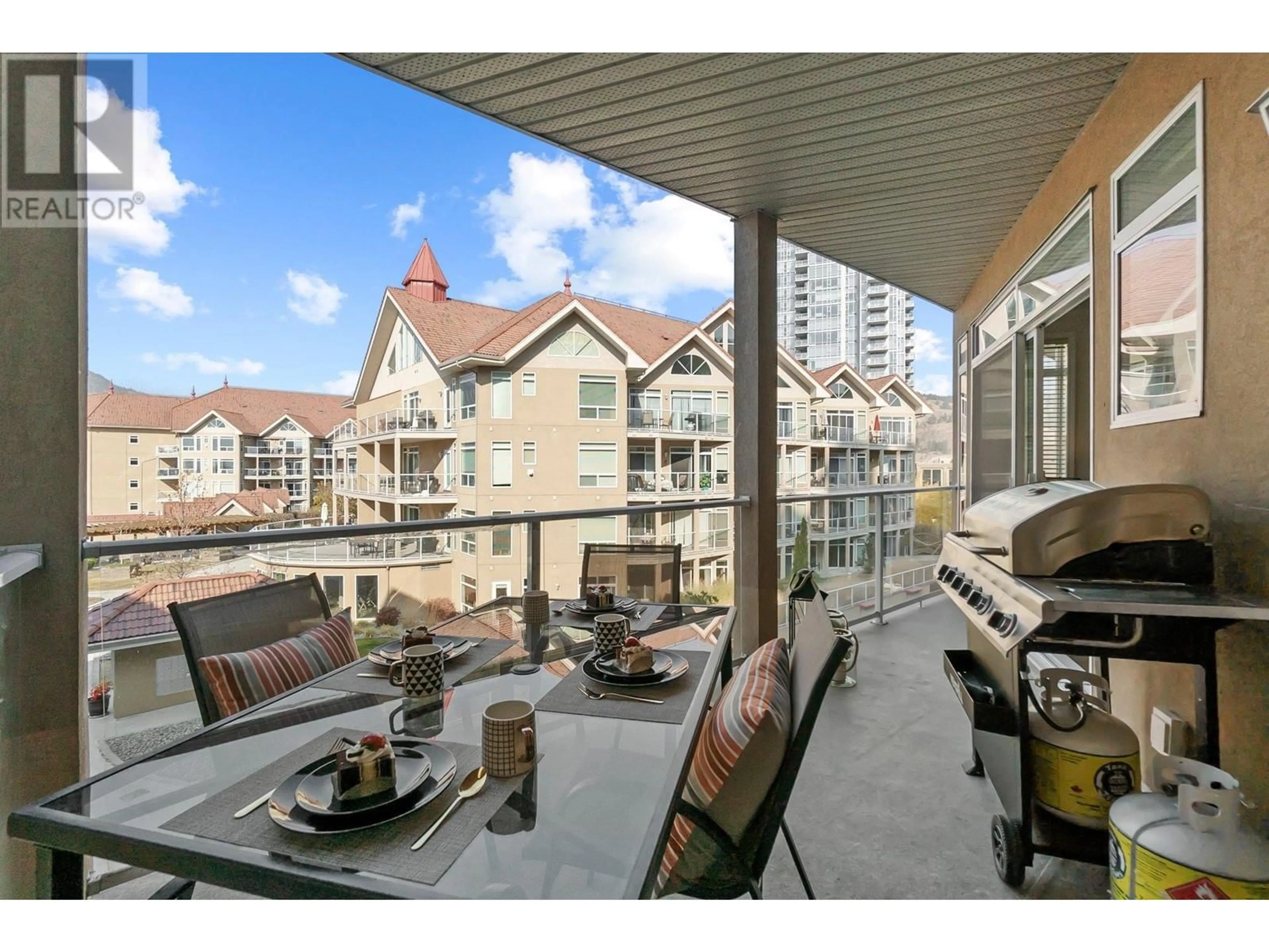 Patio, city buildings view from balcony for 535 - 1088 SUNSET DRIVE, Kelowna British Columbia V1Y9W1