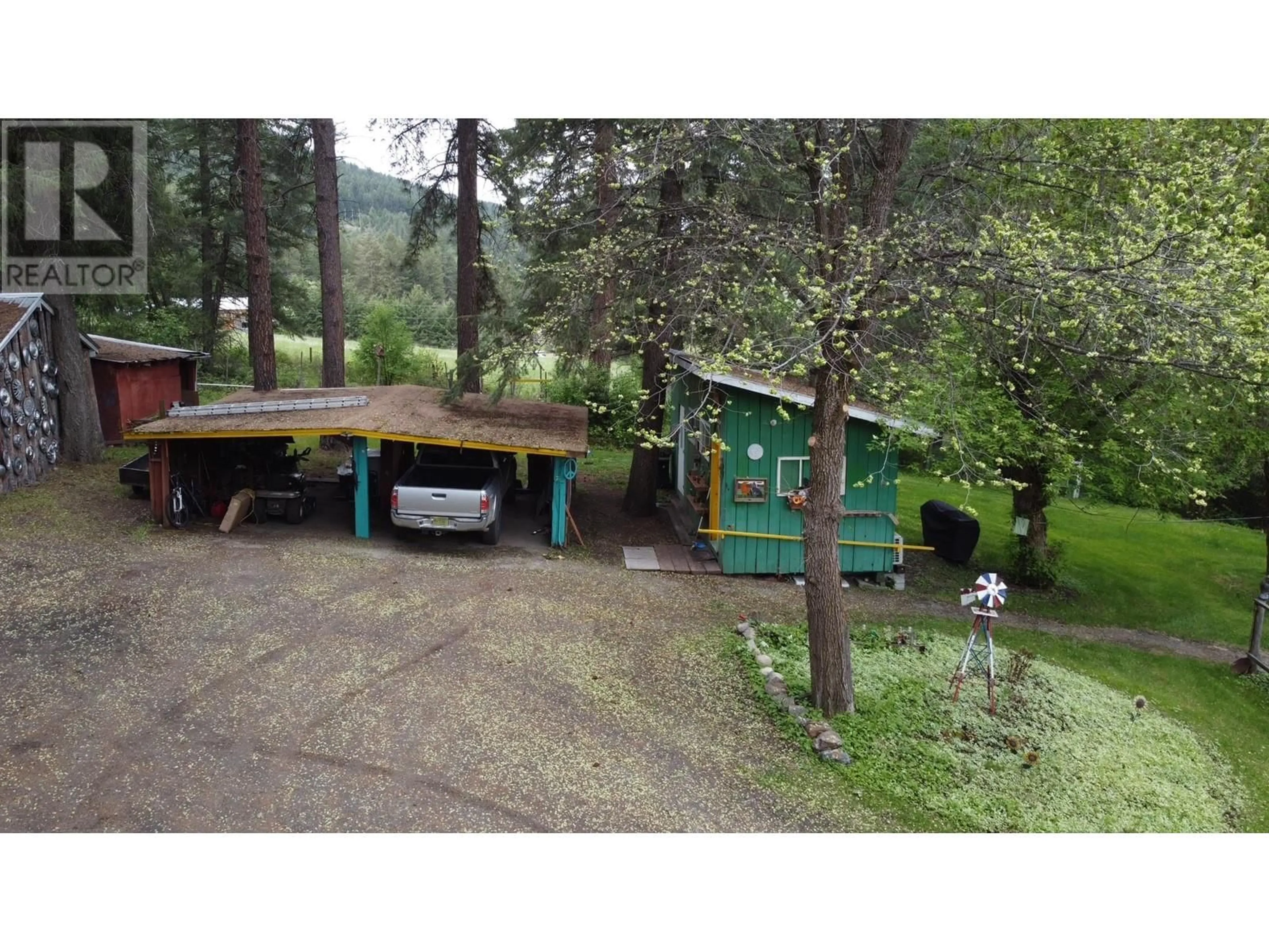 A pic from outside/outdoor area/front of a property/back of a property/a pic from drone, forest/trees view for 3900 HIGHWAY 3 HIGHWAY, Rock Creek British Columbia V0H1Y0
