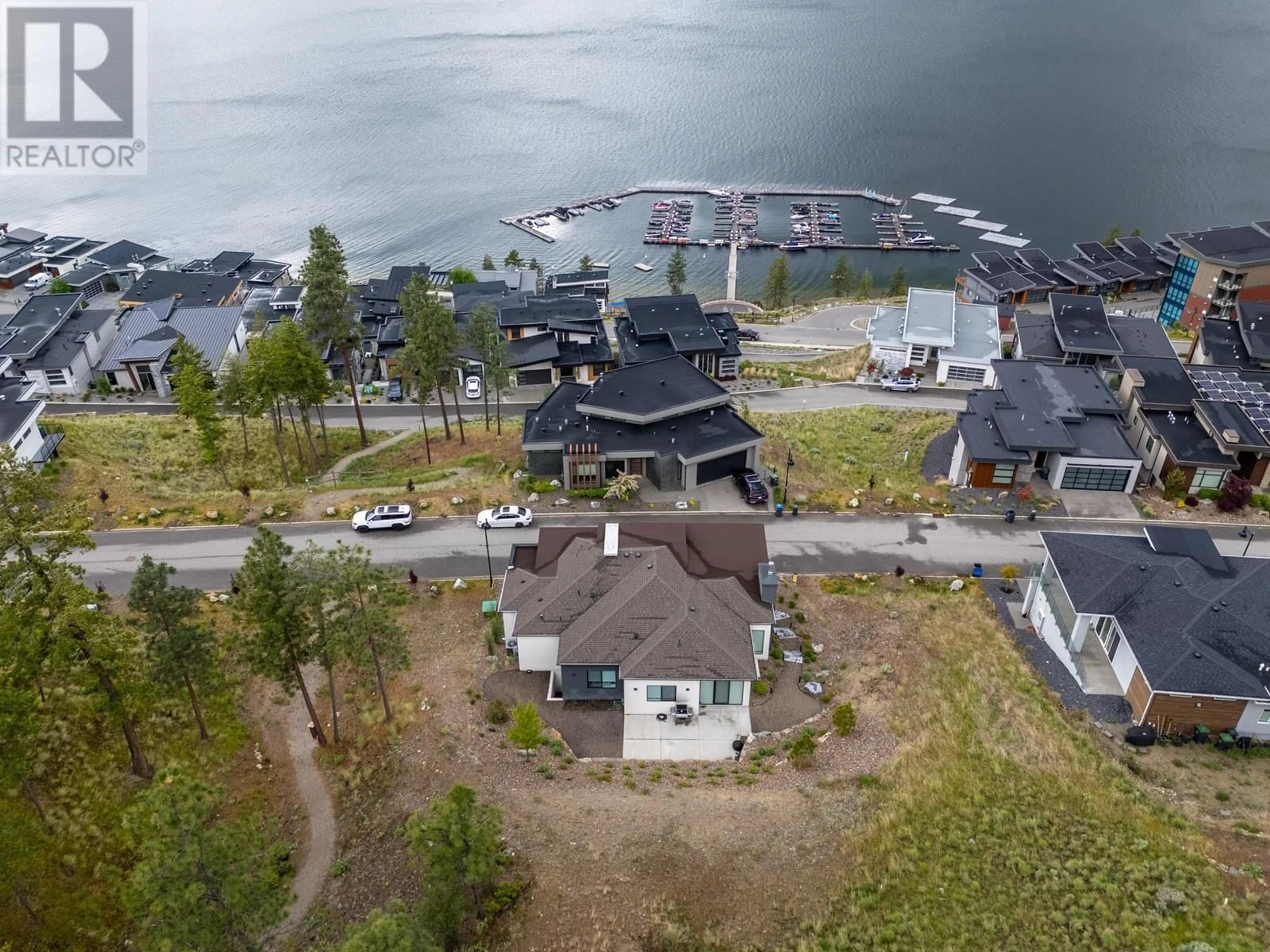 A pic from outside/outdoor area/front of a property/back of a property/a pic from drone, water/lake/river/ocean view for 3387 WATER BIRCH CIRCLE, Kelowna British Columbia V1V3G1