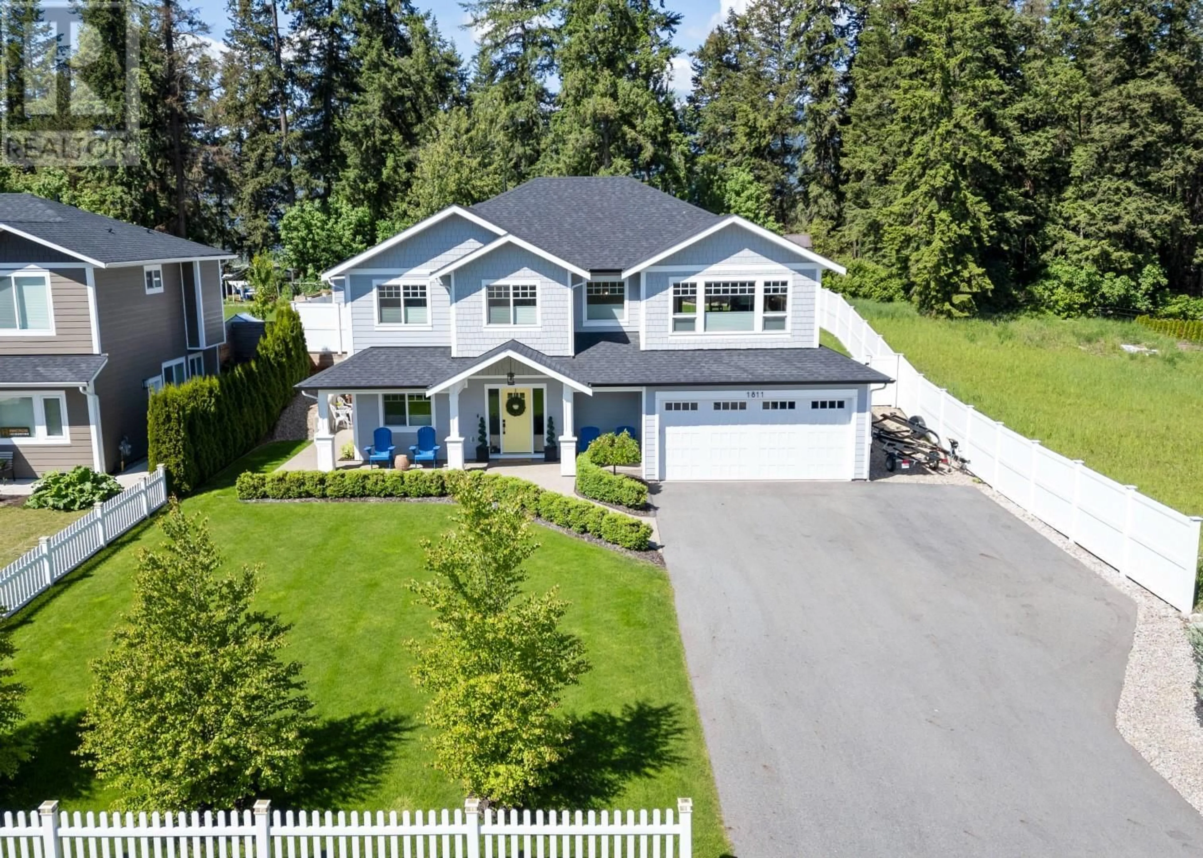 A pic from outside/outdoor area/front of a property/back of a property/a pic from drone, street for 1811 22 STREET NORTHEAST, Salmon Arm British Columbia V1E3M9