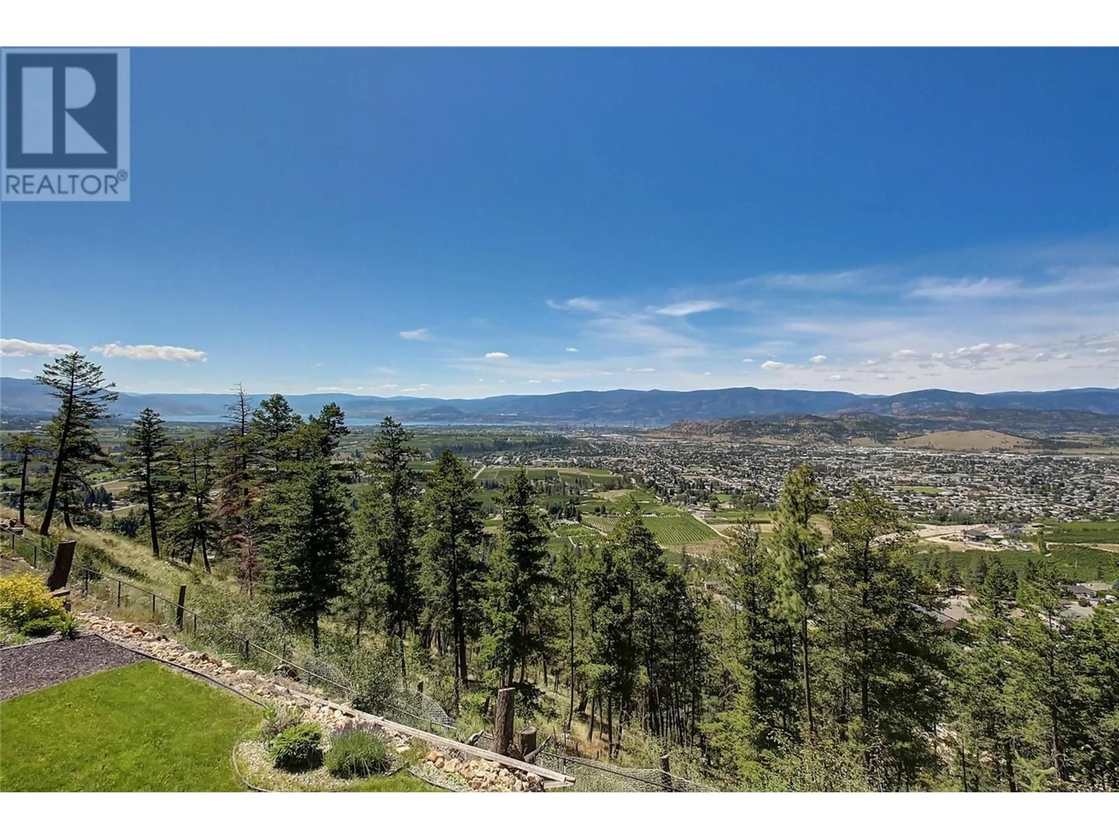 A pic from outside/outdoor area/front of a property/back of a property/a pic from drone, mountain view for 1342 MINE HILL DRIVE, Kelowna British Columbia V1P1T6