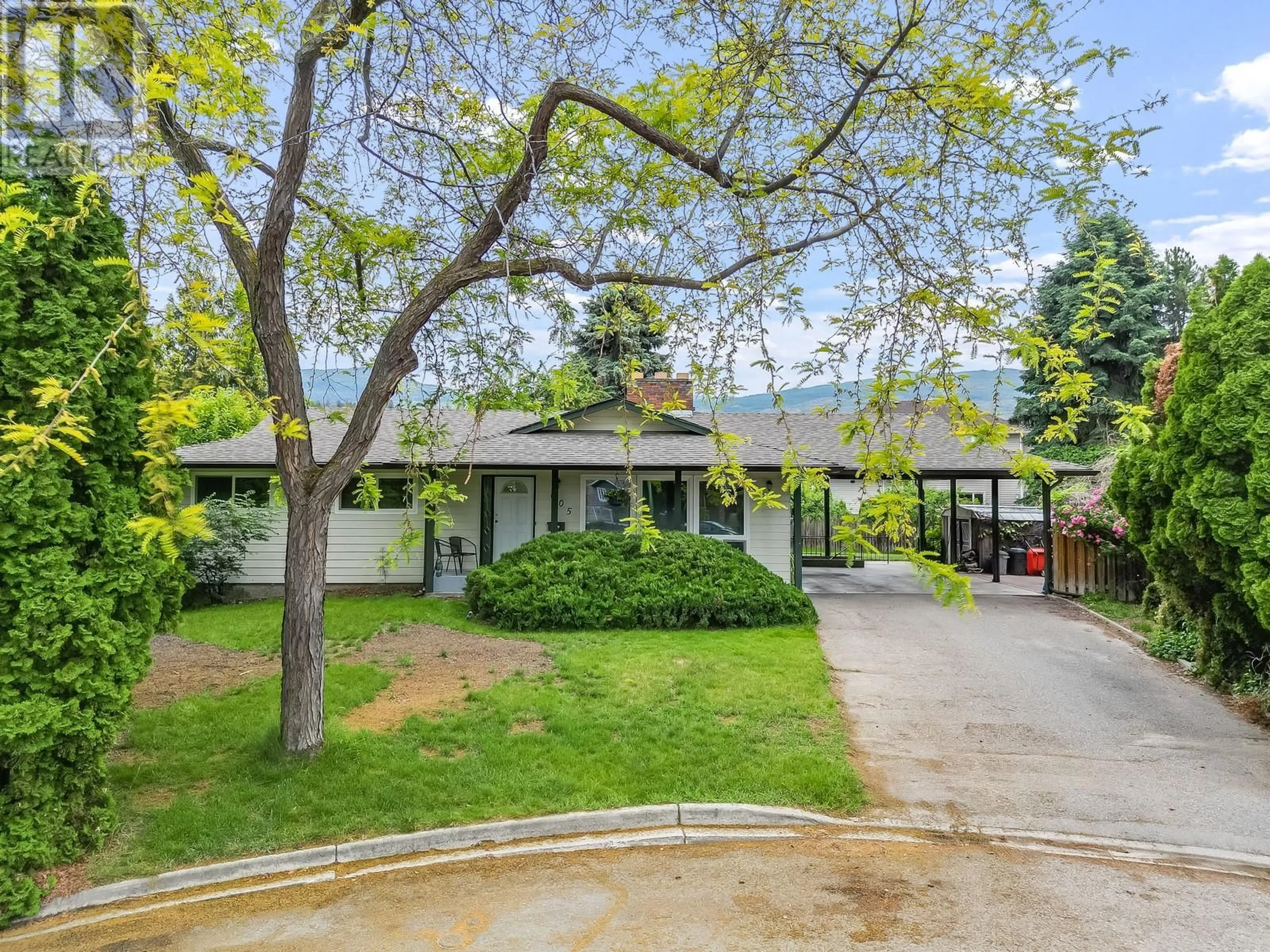 A pic from outside/outdoor area/front of a property/back of a property/a pic from drone, street for 605 SAN MICHELLE ROAD, Kelowna British Columbia V1W2J5