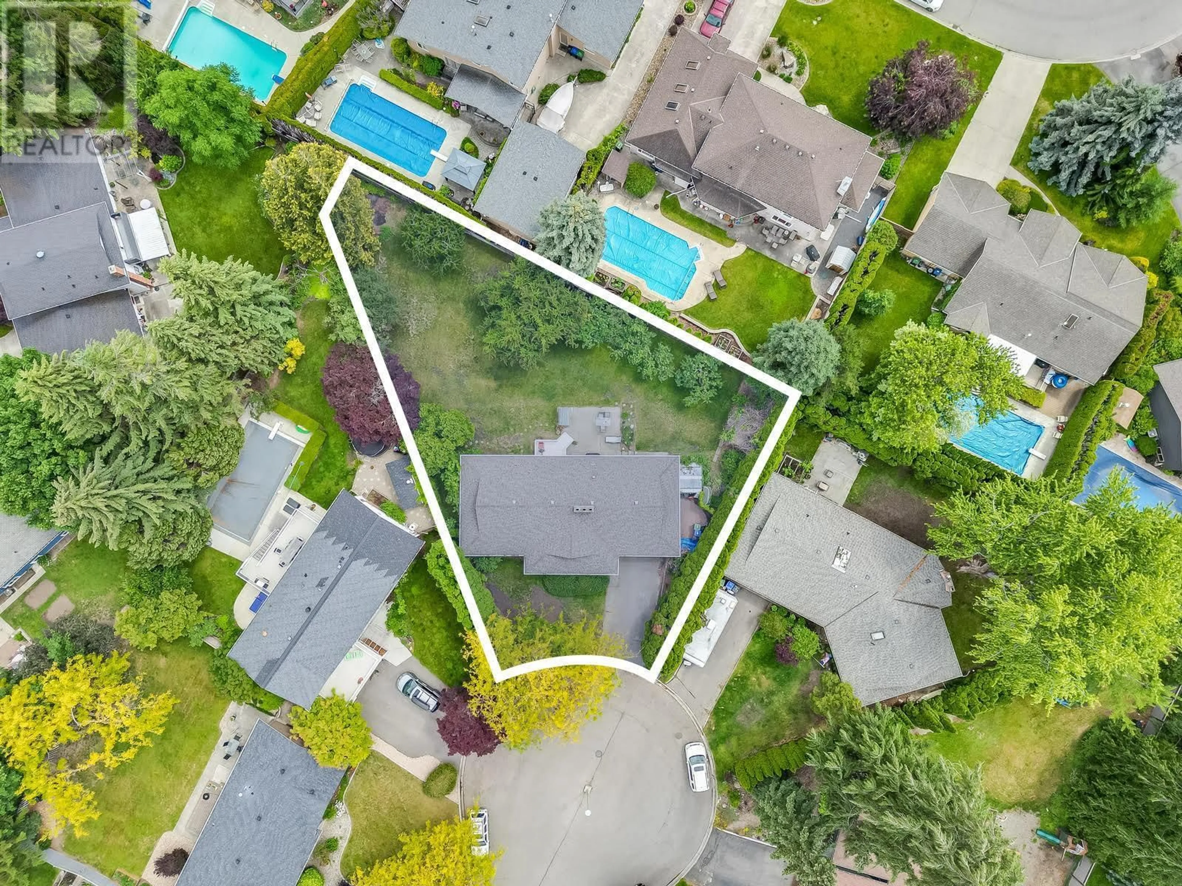 A pic from outside/outdoor area/front of a property/back of a property/a pic from drone, street for 605 SAN MICHELLE ROAD, Kelowna British Columbia V1W2J5