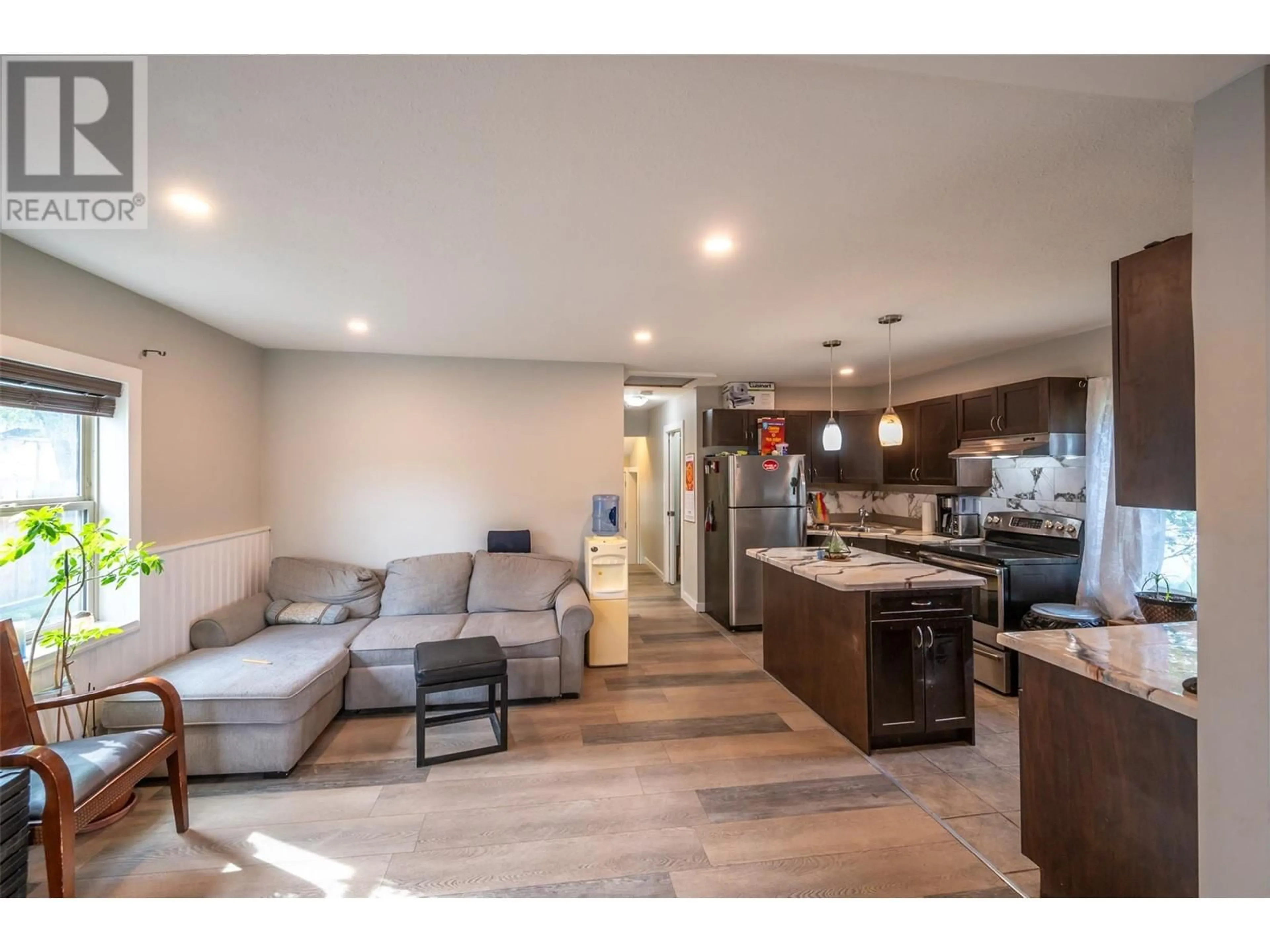 Open concept kitchen, wood/laminate floor for 508 ECKHARDT AVENUE EAST, Penticton British Columbia V2A1Z8