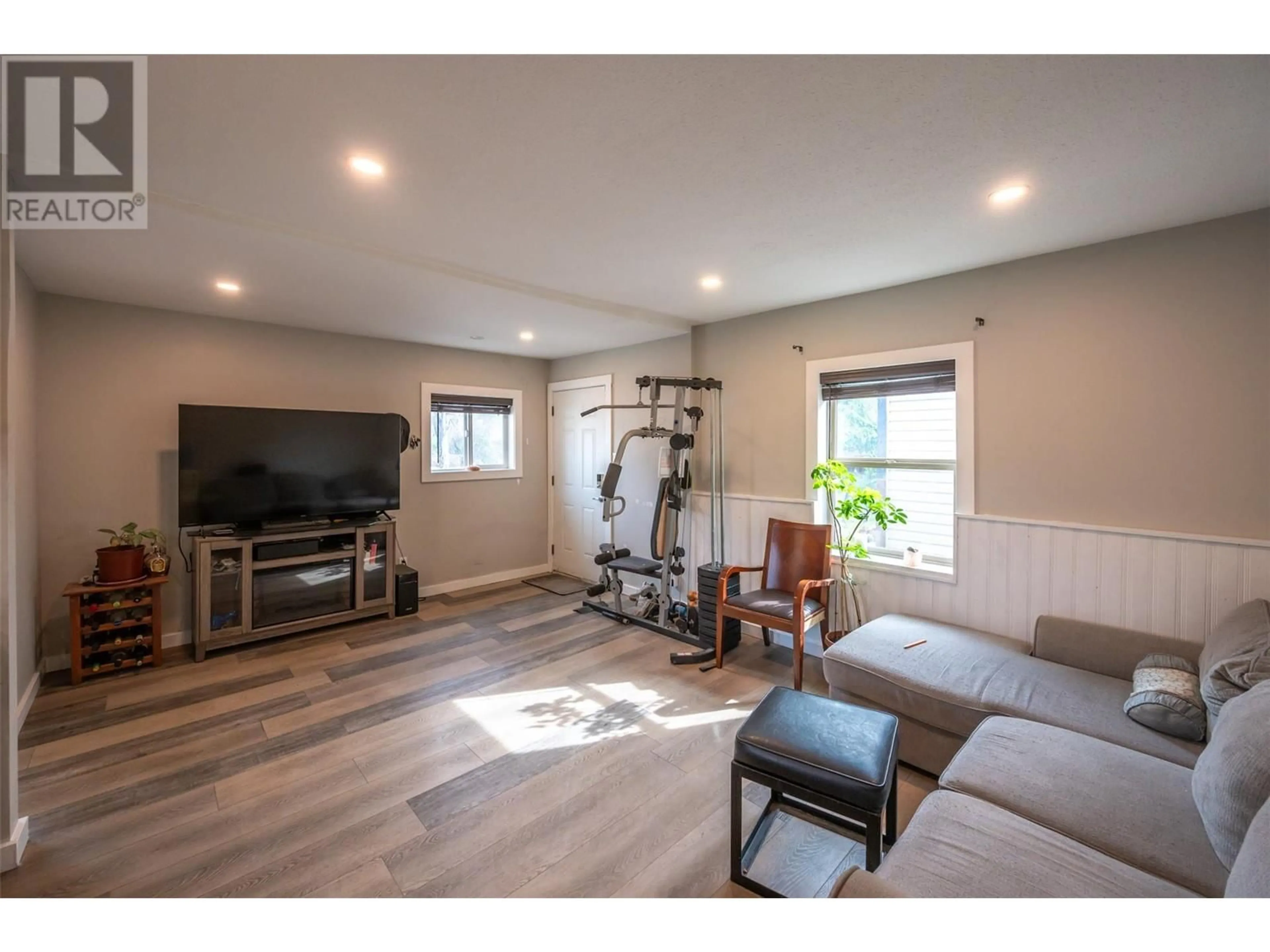 Living room with furniture, wood/laminate floor for 508 ECKHARDT AVENUE EAST, Penticton British Columbia V2A1Z8