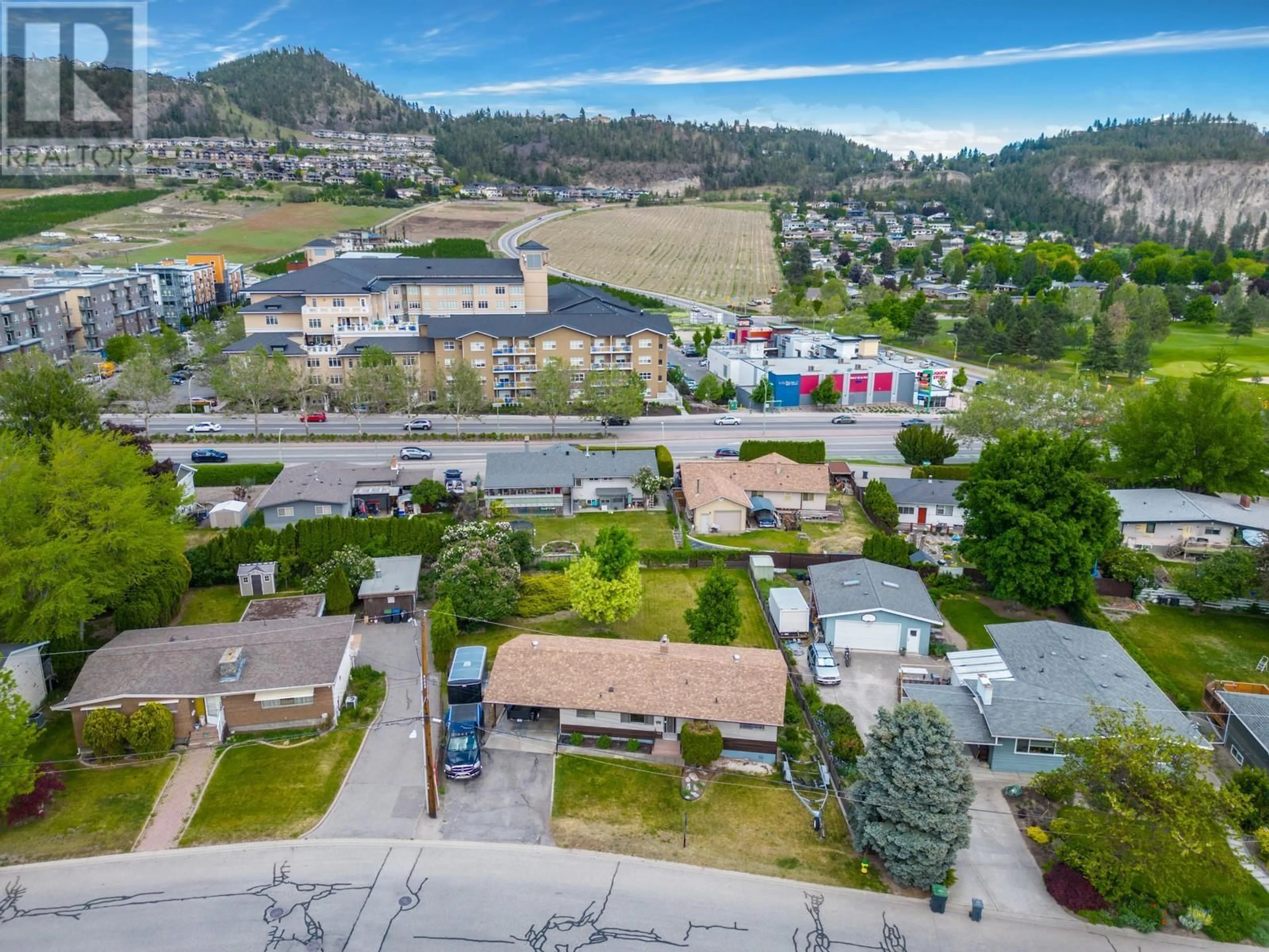 A pic from outside/outdoor area/front of a property/back of a property/a pic from drone, mountain view for 715 GLENBURN STREET, Kelowna British Columbia V1Y4G4