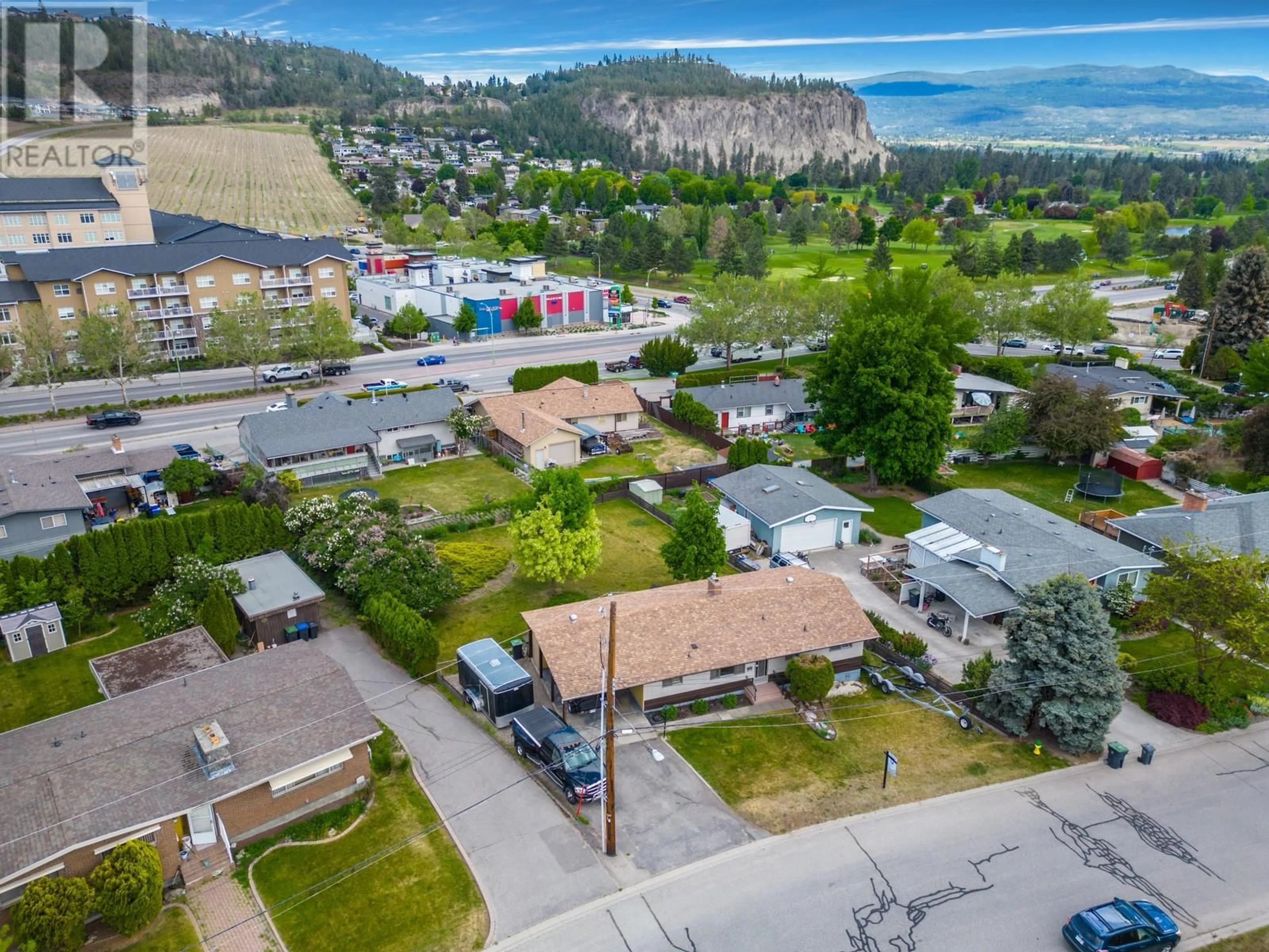 A pic from outside/outdoor area/front of a property/back of a property/a pic from drone, mountain view for 715 GLENBURN STREET, Kelowna British Columbia V1Y4G4