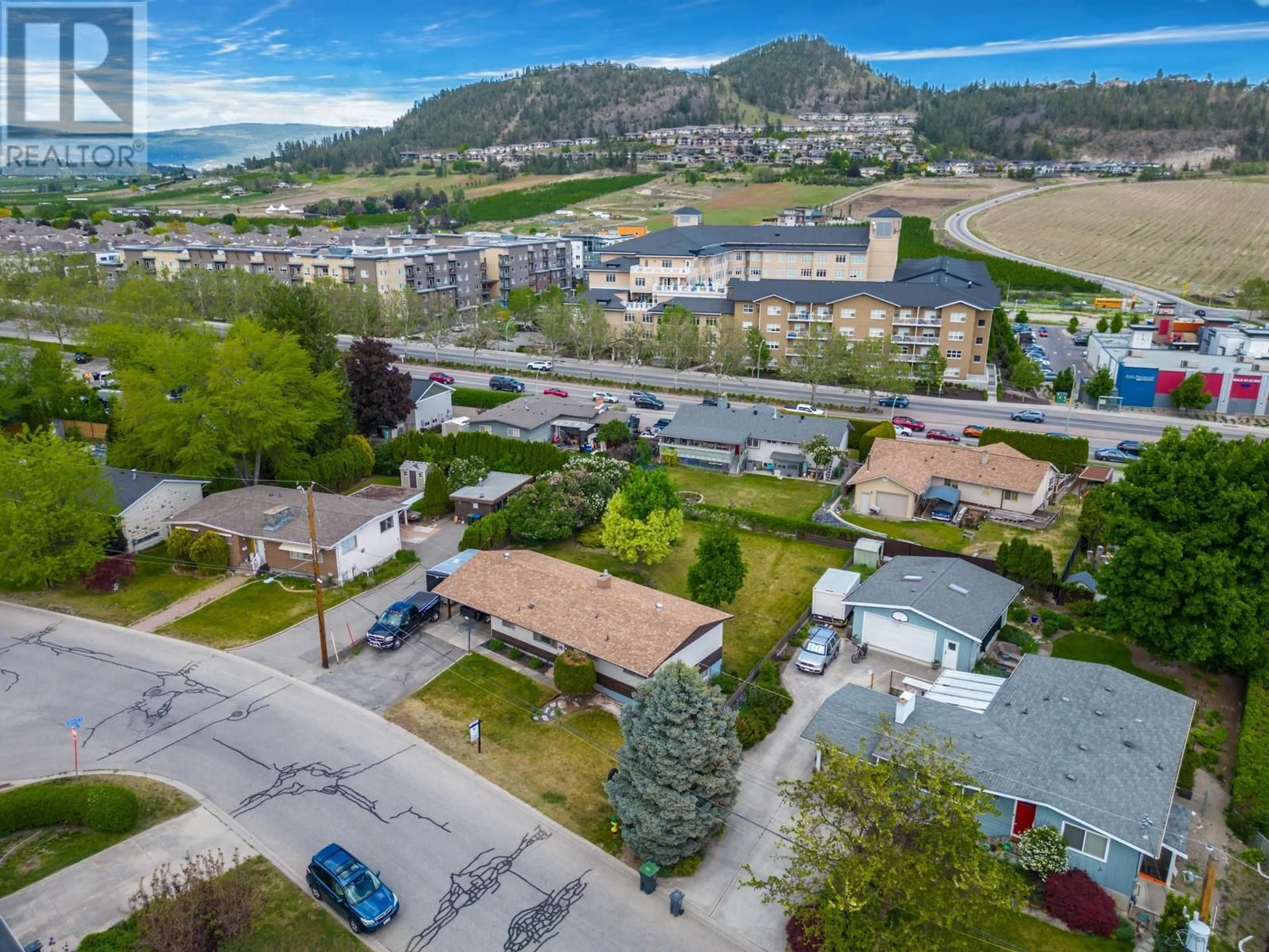 A pic from outside/outdoor area/front of a property/back of a property/a pic from drone, mountain view for 715 GLENBURN STREET, Kelowna British Columbia V1Y4G4