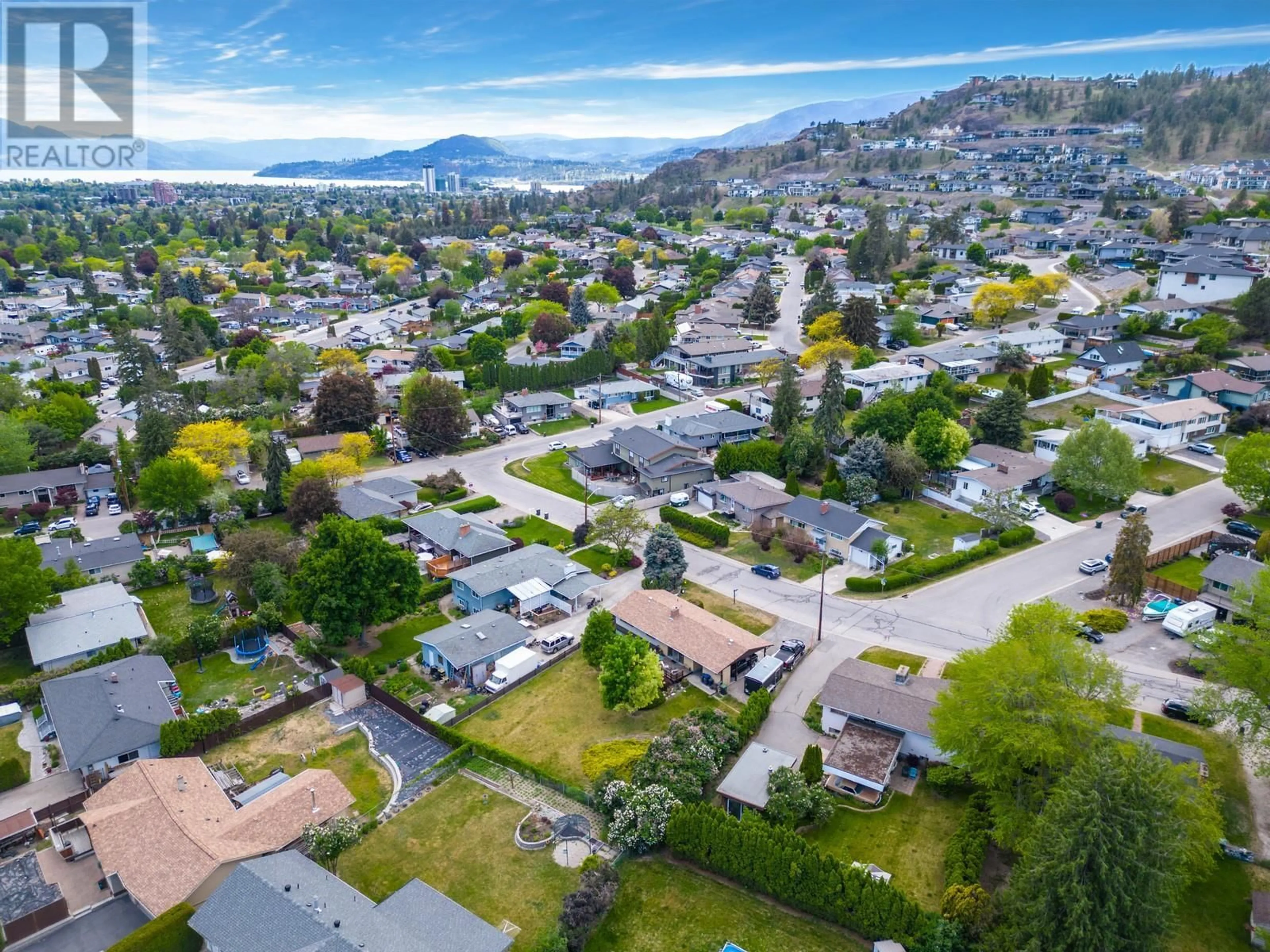 A pic from outside/outdoor area/front of a property/back of a property/a pic from drone, mountain view for 715 GLENBURN STREET, Kelowna British Columbia V1Y4G4