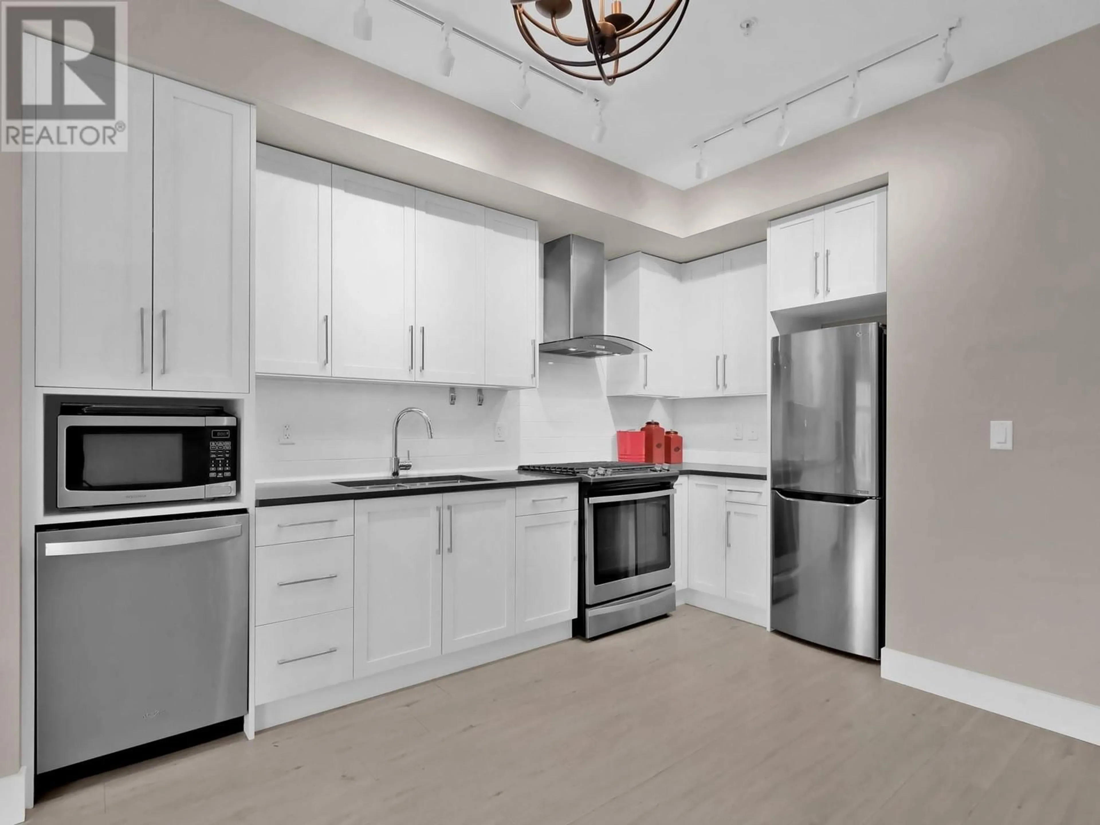 Open concept kitchen, ceramic/tile floor for 219 - 4380 LAKESHORE ROAD, Kelowna British Columbia V1W5N3