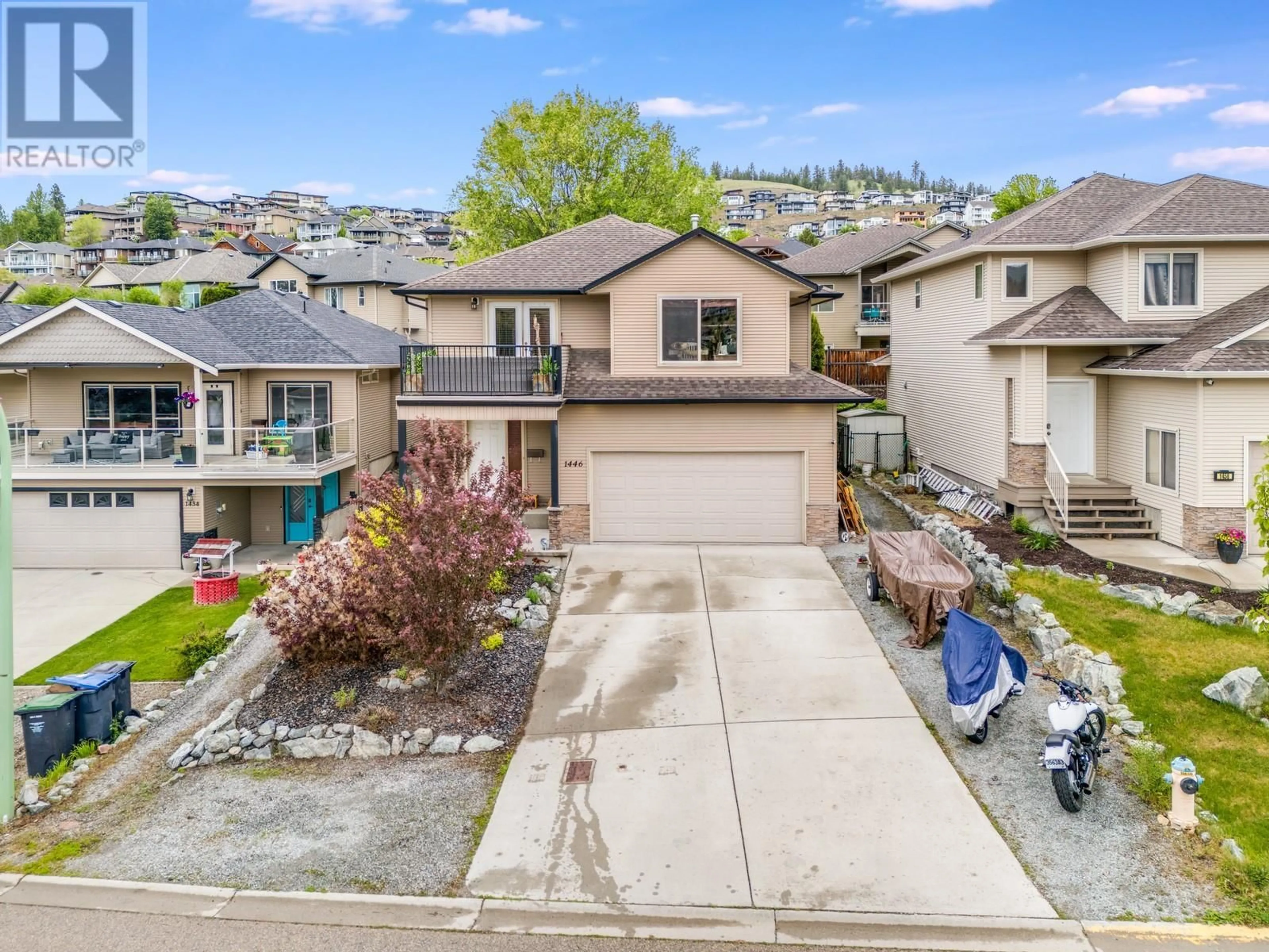 A pic from outside/outdoor area/front of a property/back of a property/a pic from drone, street for 1446 TANEMURA CRESCENT, Kelowna British Columbia V1P1N8