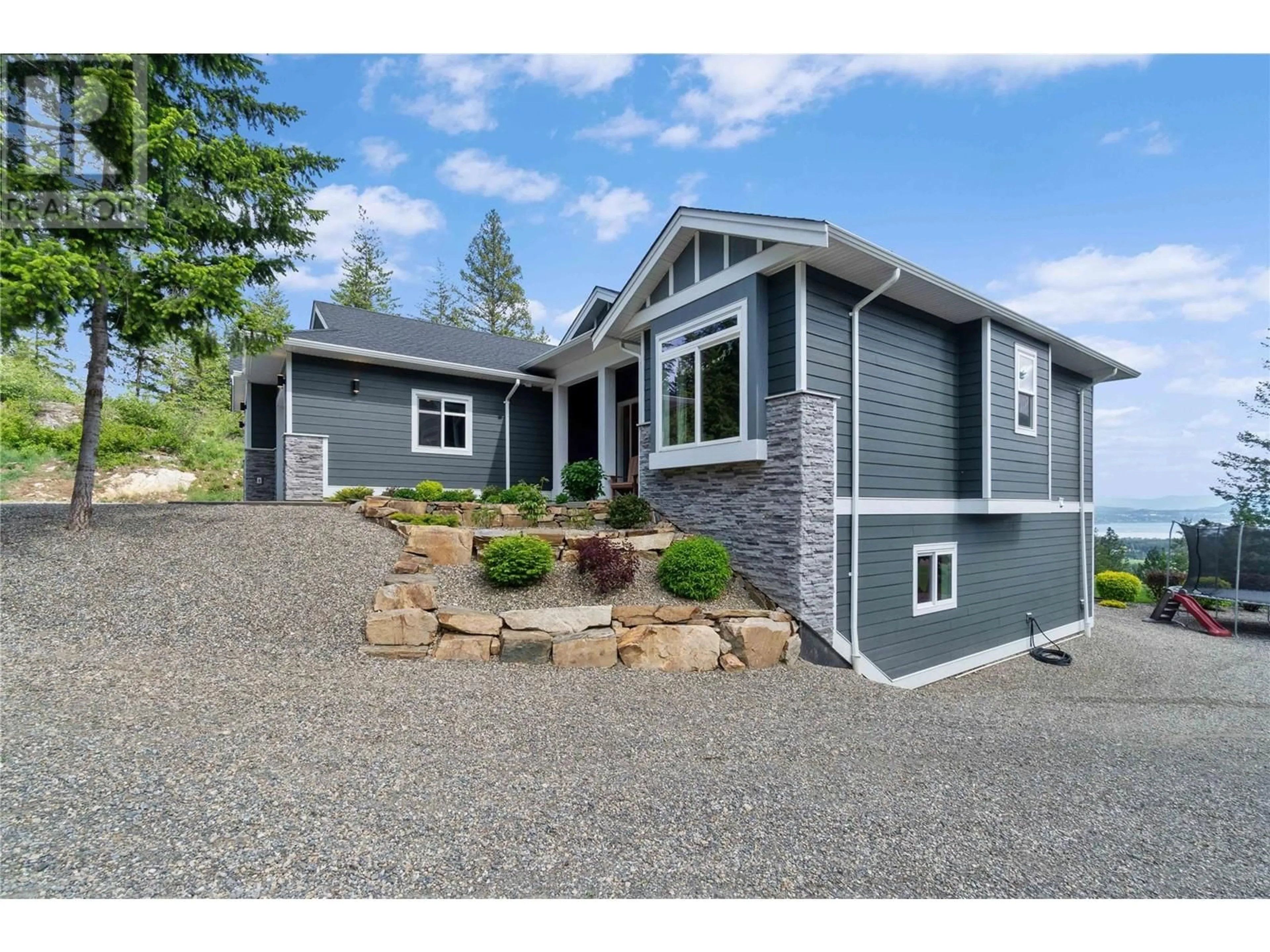 Home with vinyl exterior material, street for 1750 RECLINE RIDGE ROAD, Tappen British Columbia V0E2X0