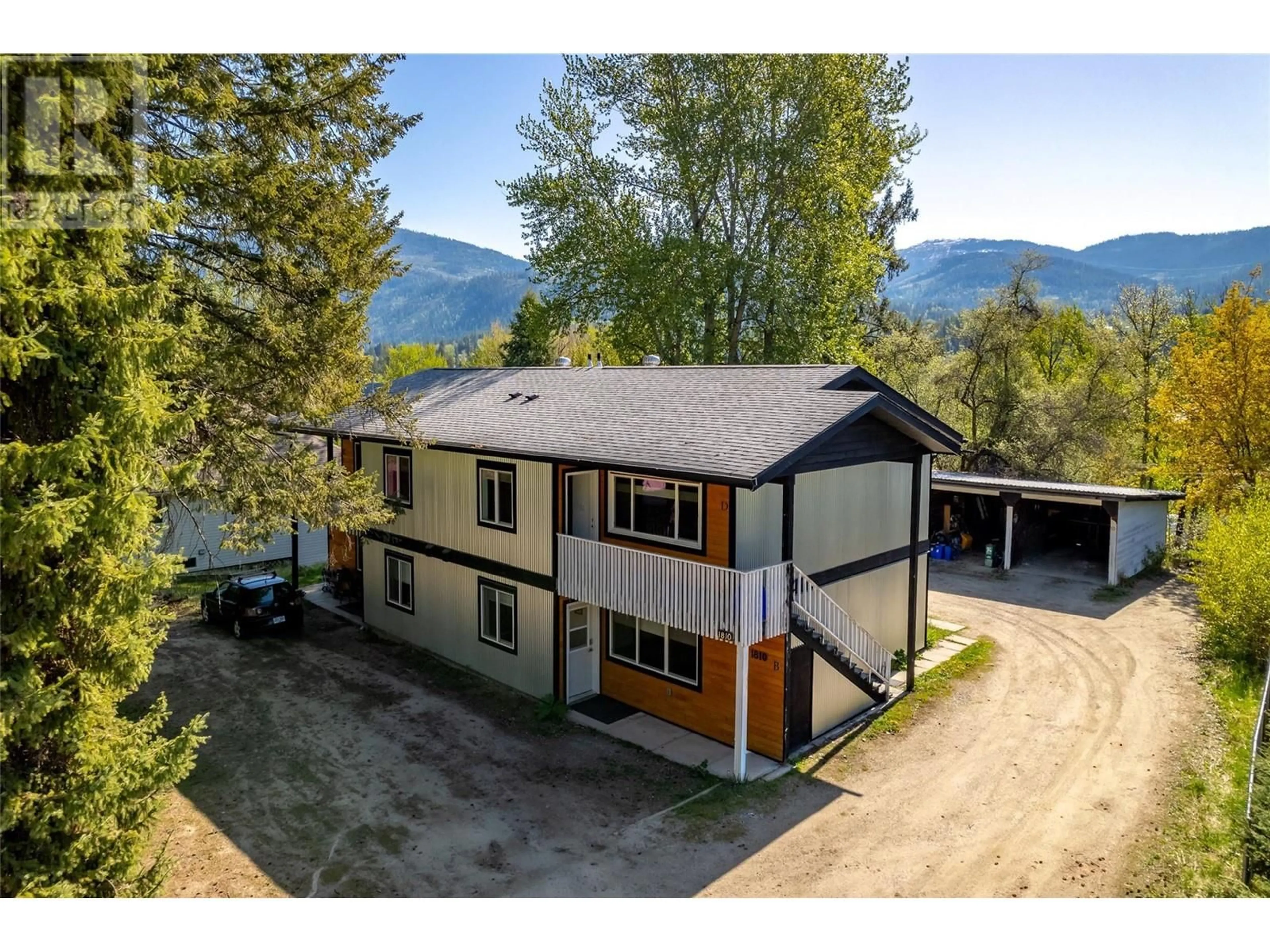 A pic from outside/outdoor area/front of a property/back of a property/a pic from drone, mountain view for 1810 FIRST STREET, Fruitvale British Columbia V0G1L0