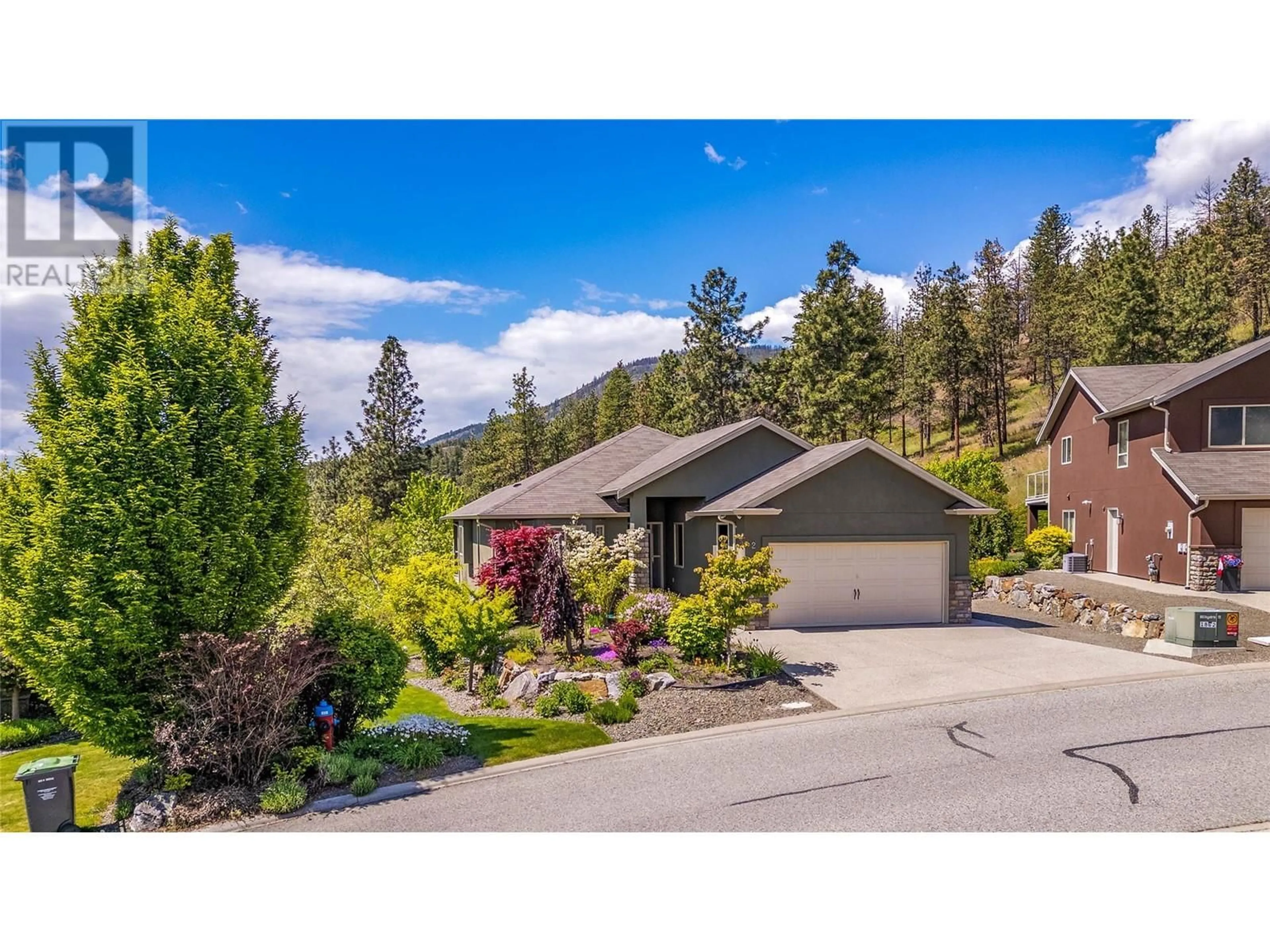 A pic from outside/outdoor area/front of a property/back of a property/a pic from drone, mountain view for 2-2040 ROSEALEE LANE, West Kelowna British Columbia V1Z4C5
