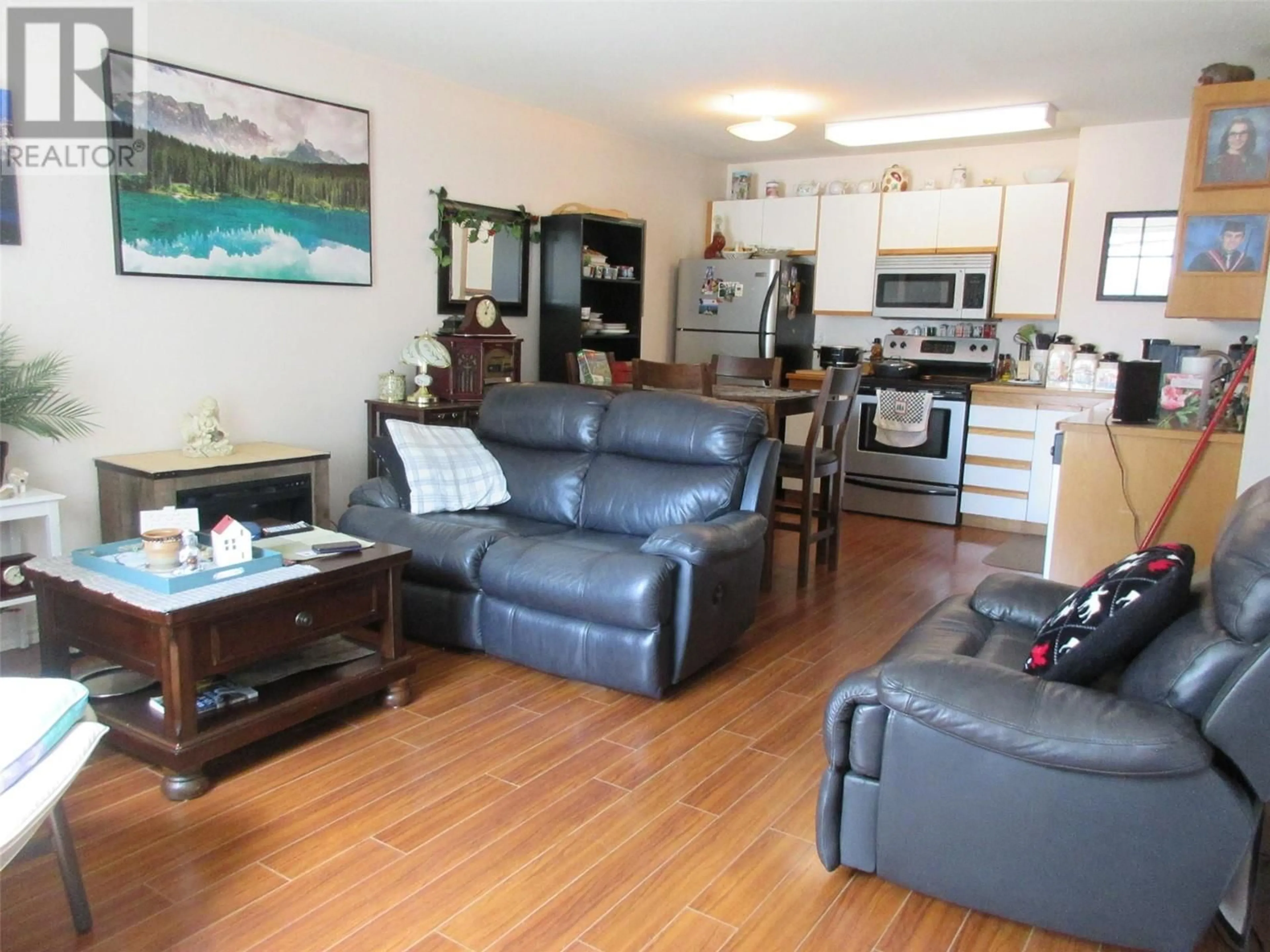 Living room with furniture, wood/laminate floor for 109 - 2295 BLAIR STREET, Merritt British Columbia V1K1B8