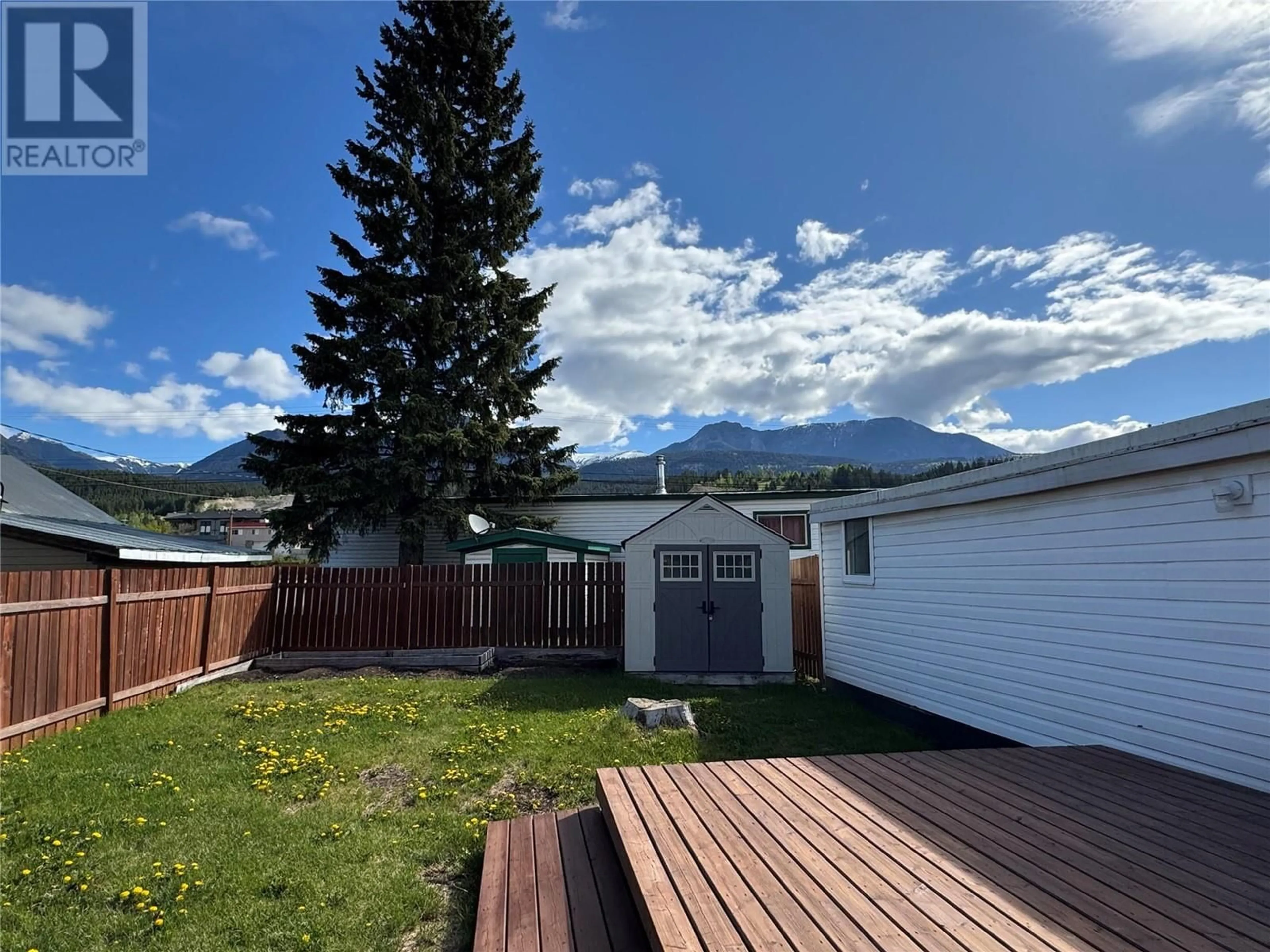A pic from outside/outdoor area/front of a property/back of a property/a pic from drone, mountain view for 15 - 1117 10TH AVENUE NORTH, Golden British Columbia V0A1H2