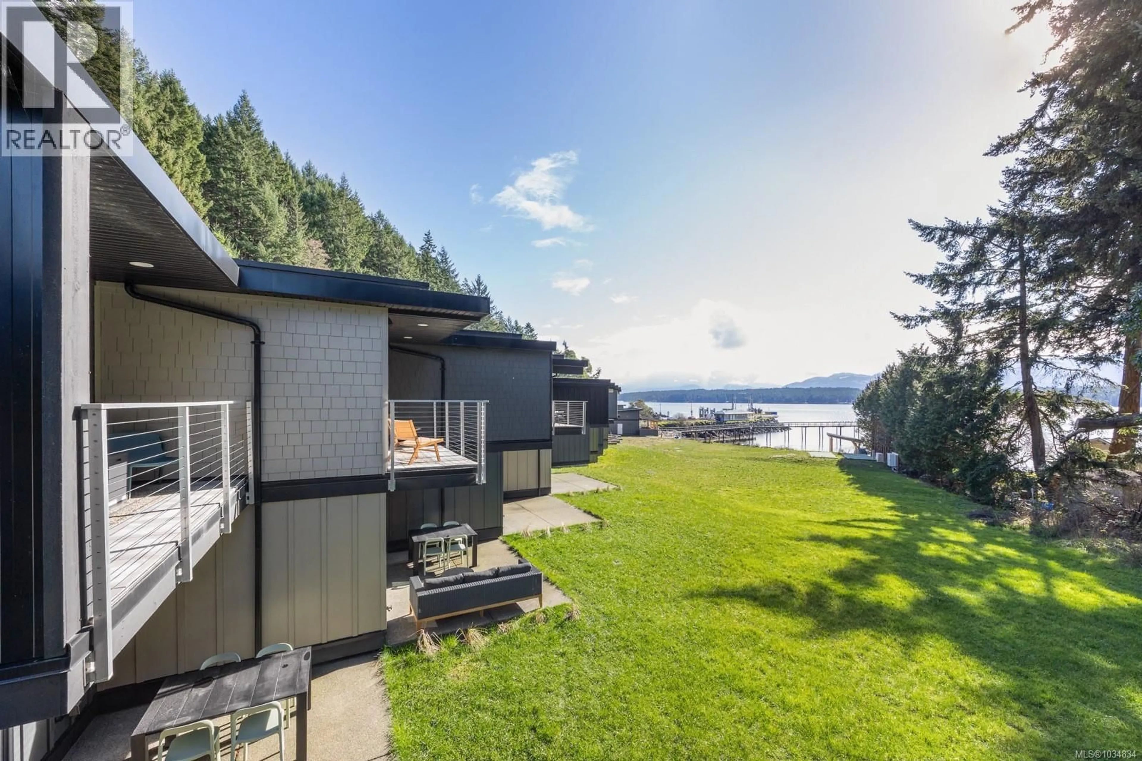 A pic from outside/outdoor area/front of a property/back of a property/a pic from drone, water/lake/river/ocean view for 213 - 4305 SHINGLE SPIT ROAD, Hornby Island British Columbia V0R1S0
