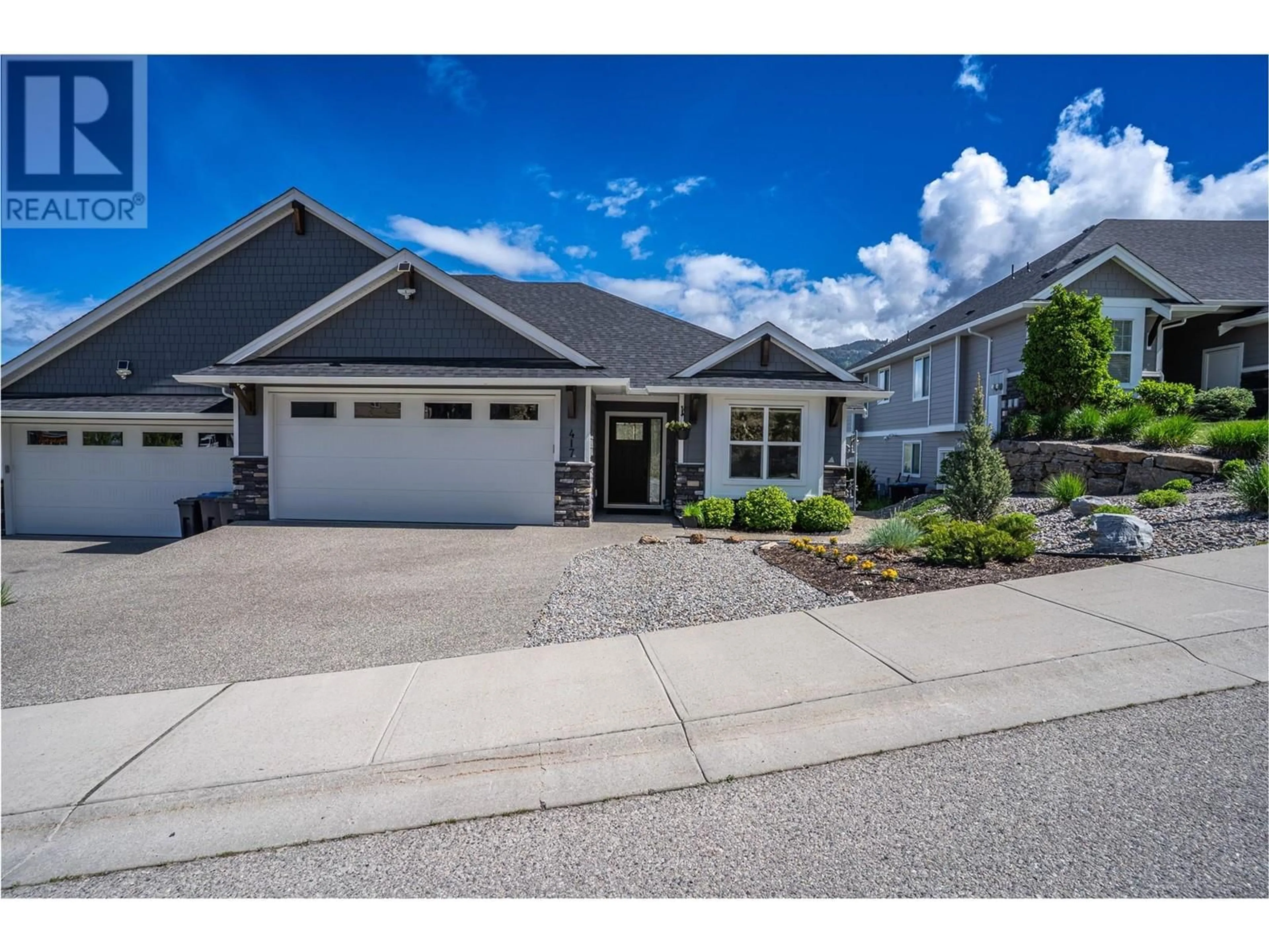 Home with vinyl exterior material, street for 417 CARNOUSTIE DRIVE, Kelowna British Columbia V1P1T1