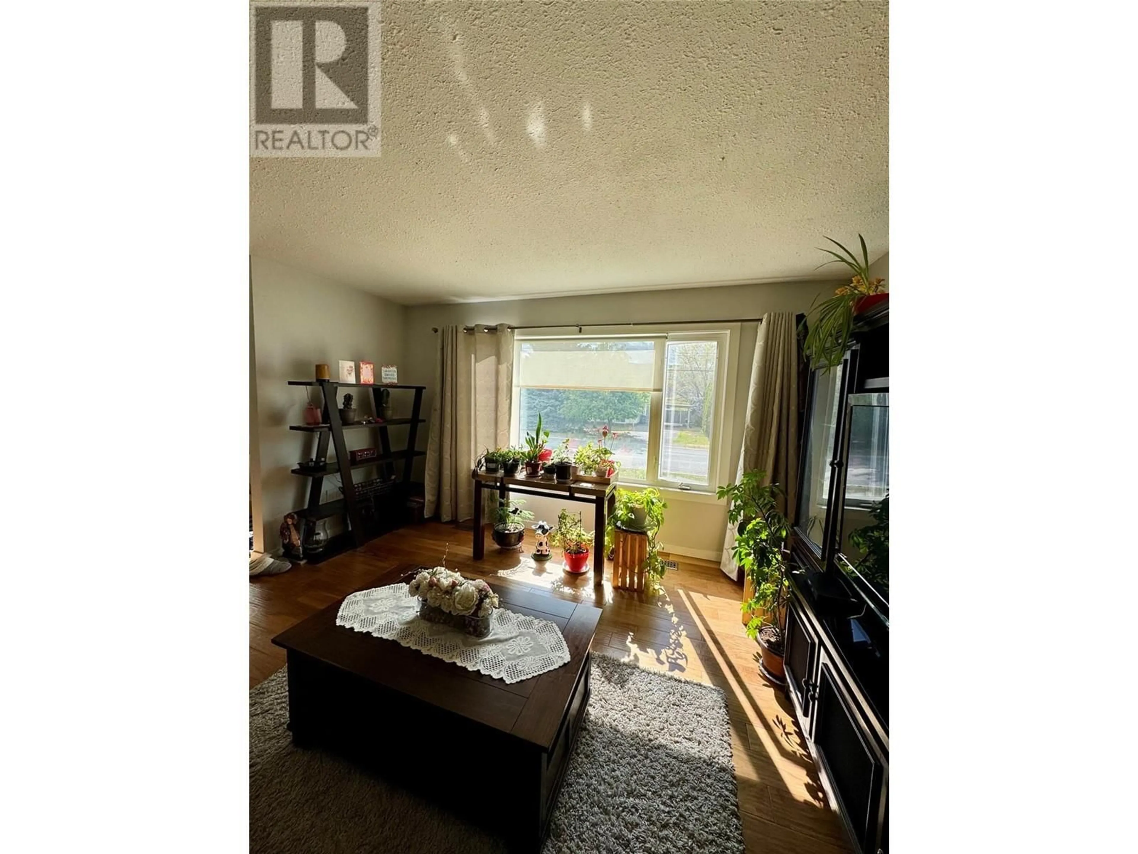 Living room with furniture, wood/laminate floor for 1740 ARMSTRONG STREET, Merritt British Columbia V1K1E7