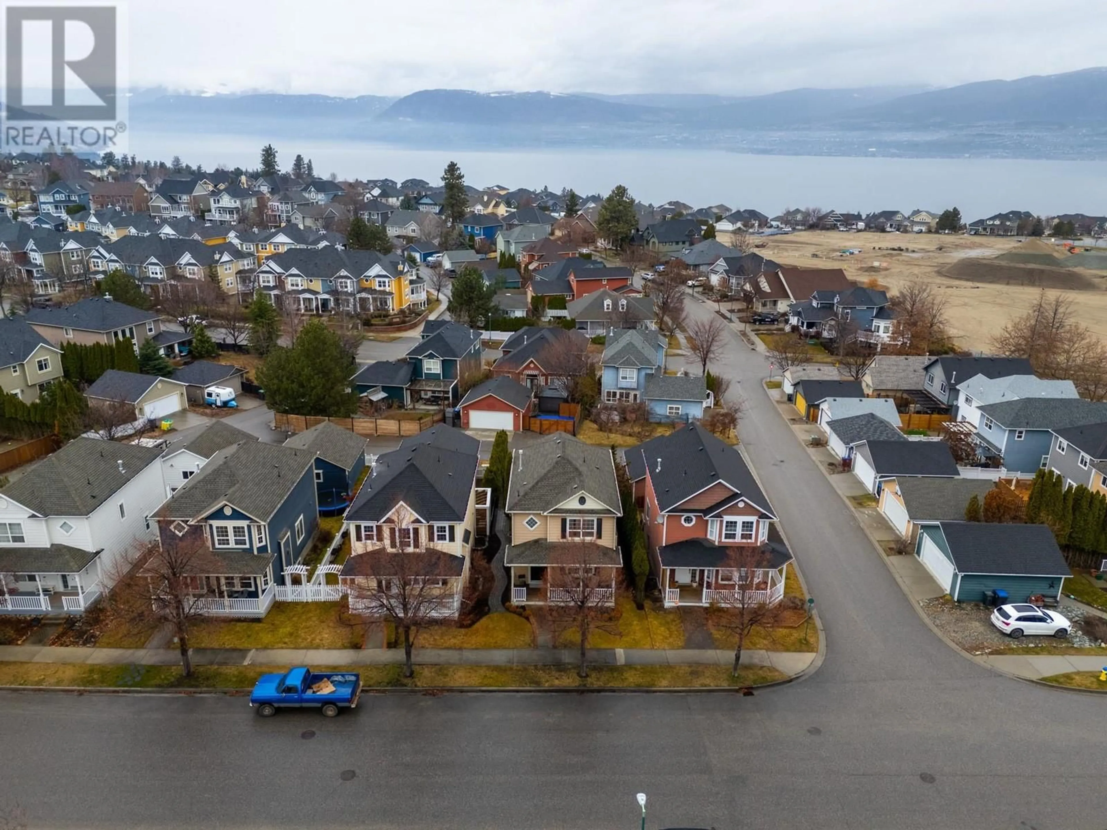 A pic from outside/outdoor area/front of a property/back of a property/a pic from drone, street for 396 MCCARREN AVENUE, Kelowna British Columbia V1W4W3