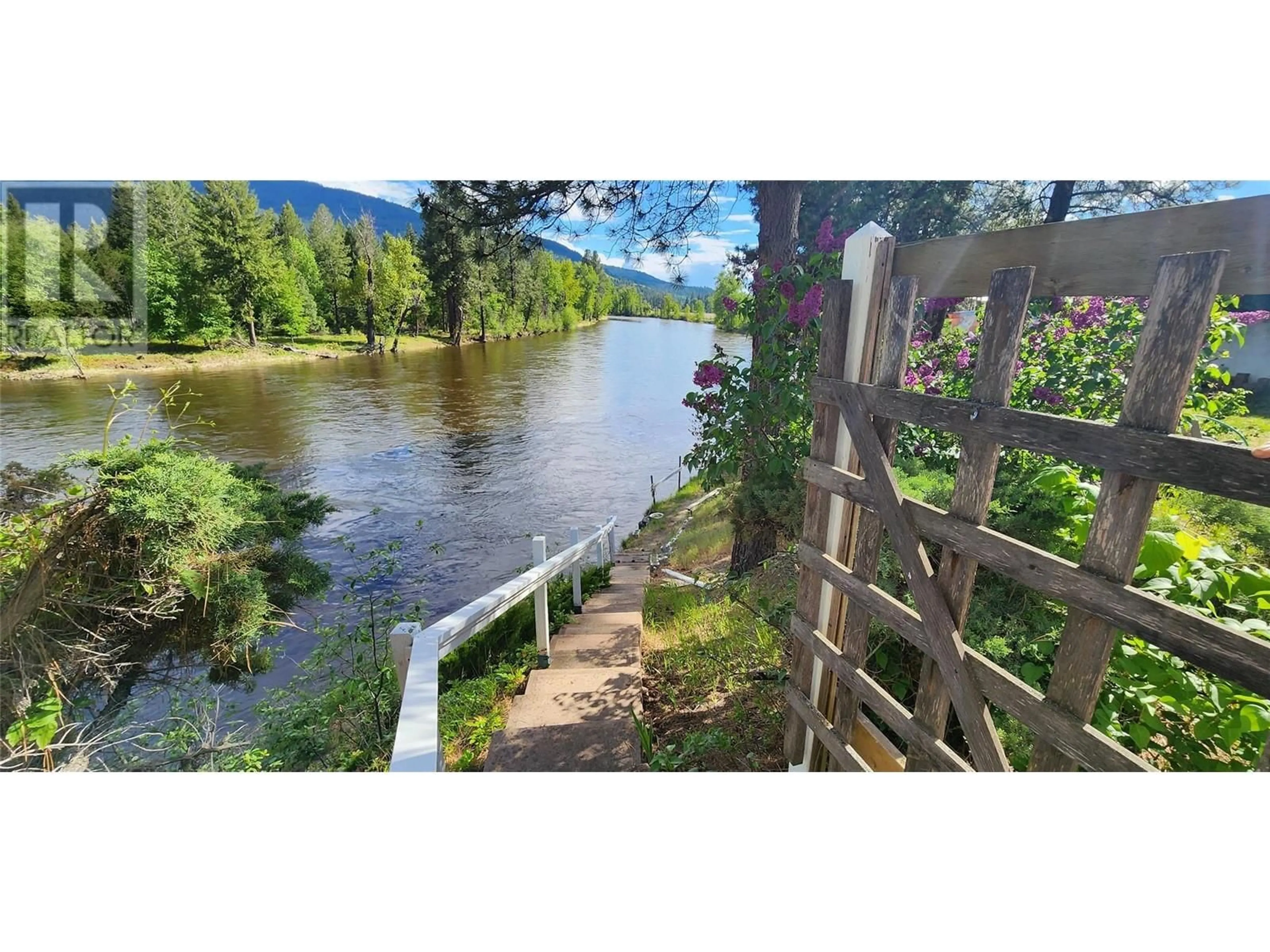 A pic from outside/outdoor area/front of a property/back of a property/a pic from drone, water/lake/river/ocean view for 3250 HALL FRONTAGE ROAD, Grand Forks British Columbia V0H1H5