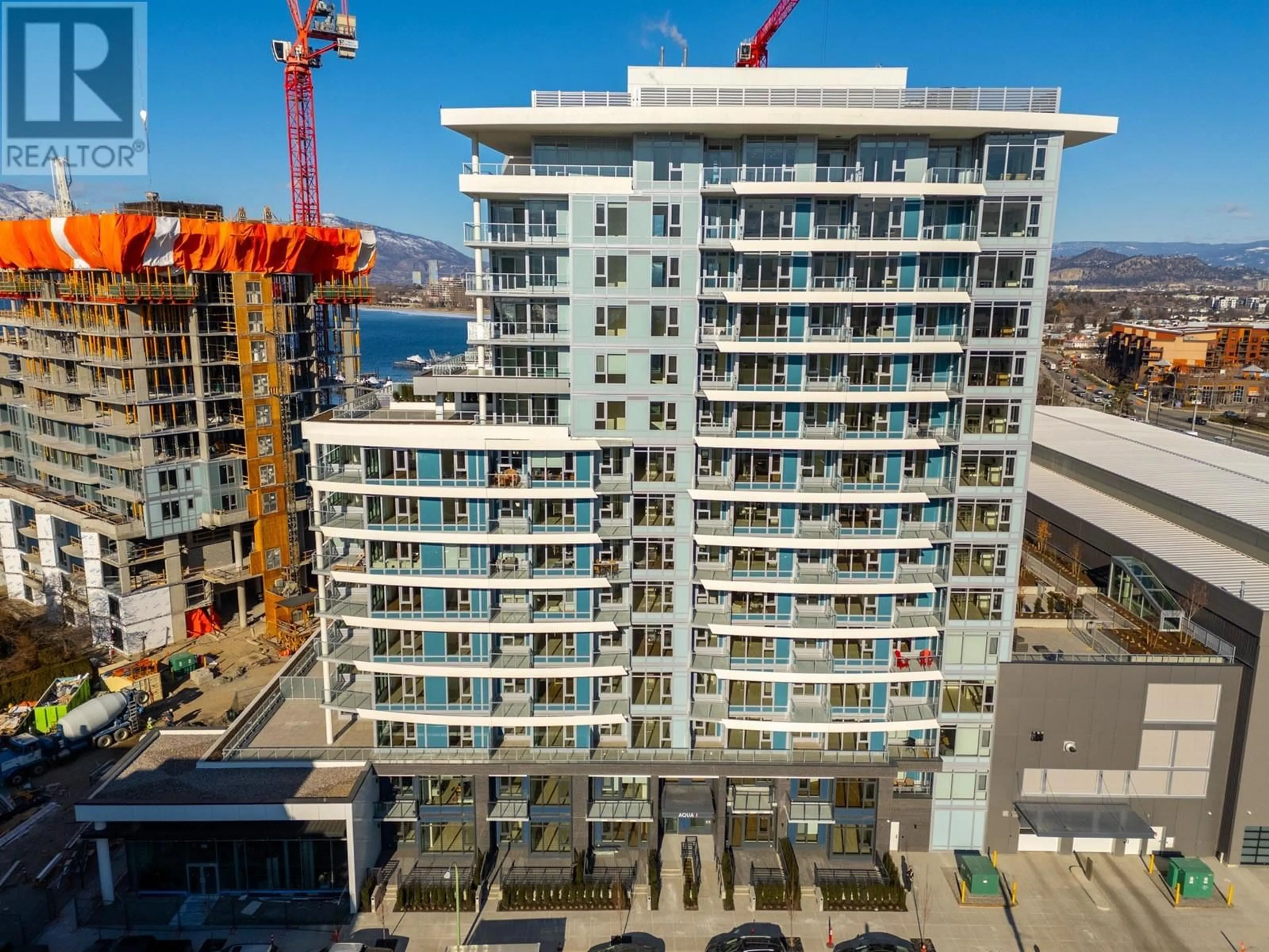A pic from outside/outdoor area/front of a property/back of a property/a pic from drone, city buildings view from balcony for 607 - 3699 CAPOZZI ROAD, Kelowna British Columbia V1W0G3