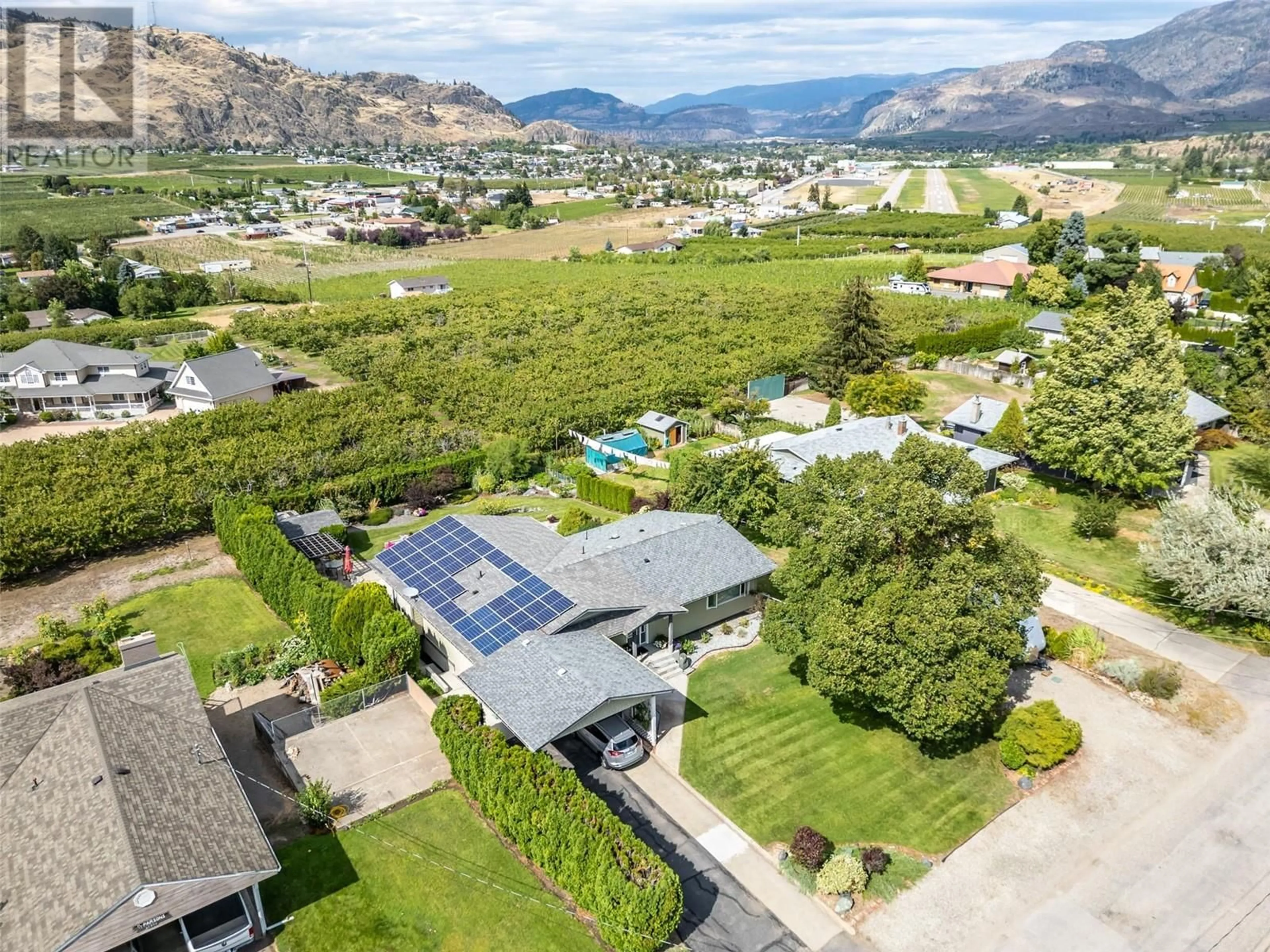 A pic from outside/outdoor area/front of a property/back of a property/a pic from drone, mountain view for 5614 YARROW STREET, Oliver British Columbia V0H1T9