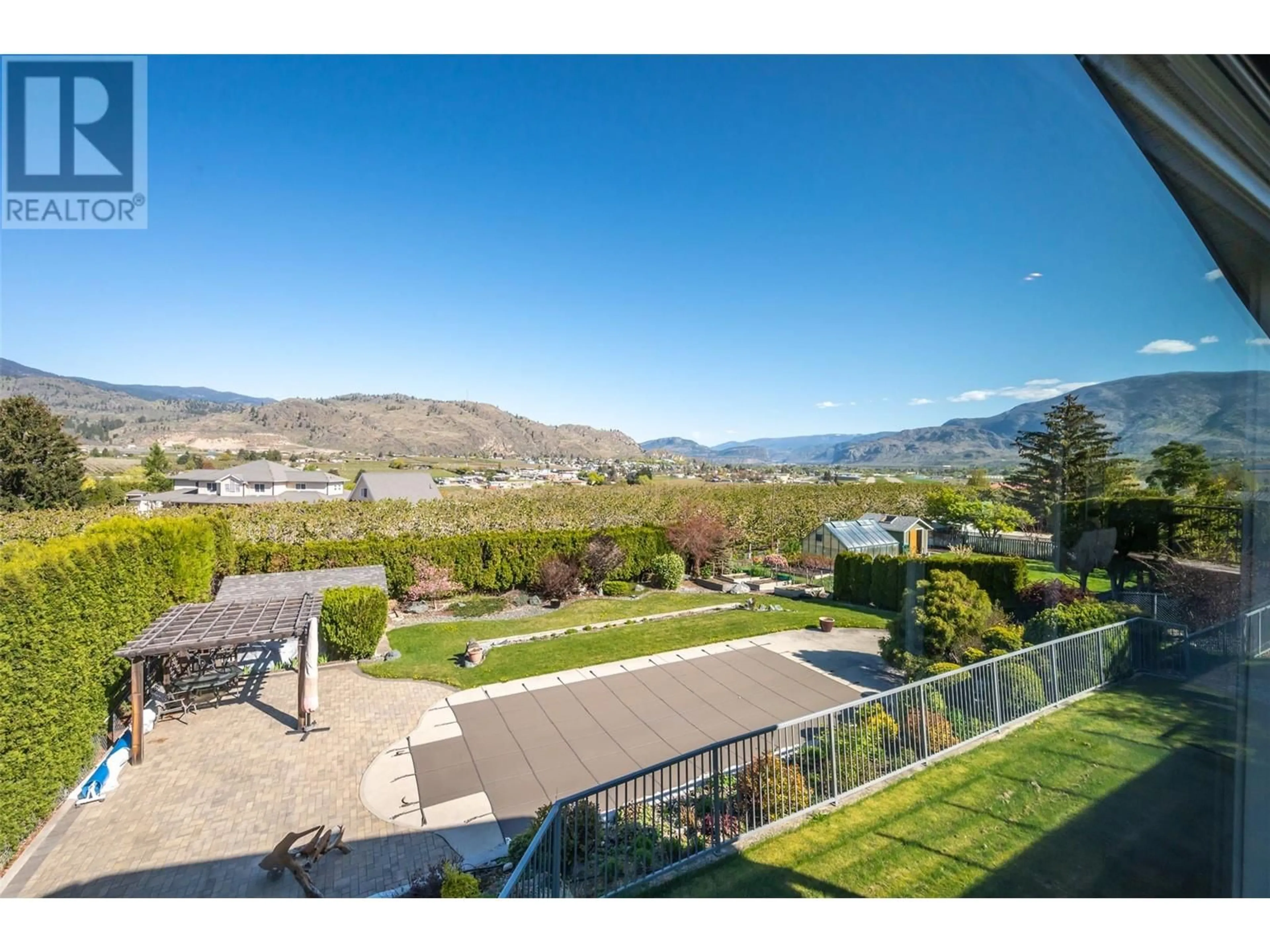 A pic from outside/outdoor area/front of a property/back of a property/a pic from drone, mountain view for 5614 YARROW STREET, Oliver British Columbia V0H1T9