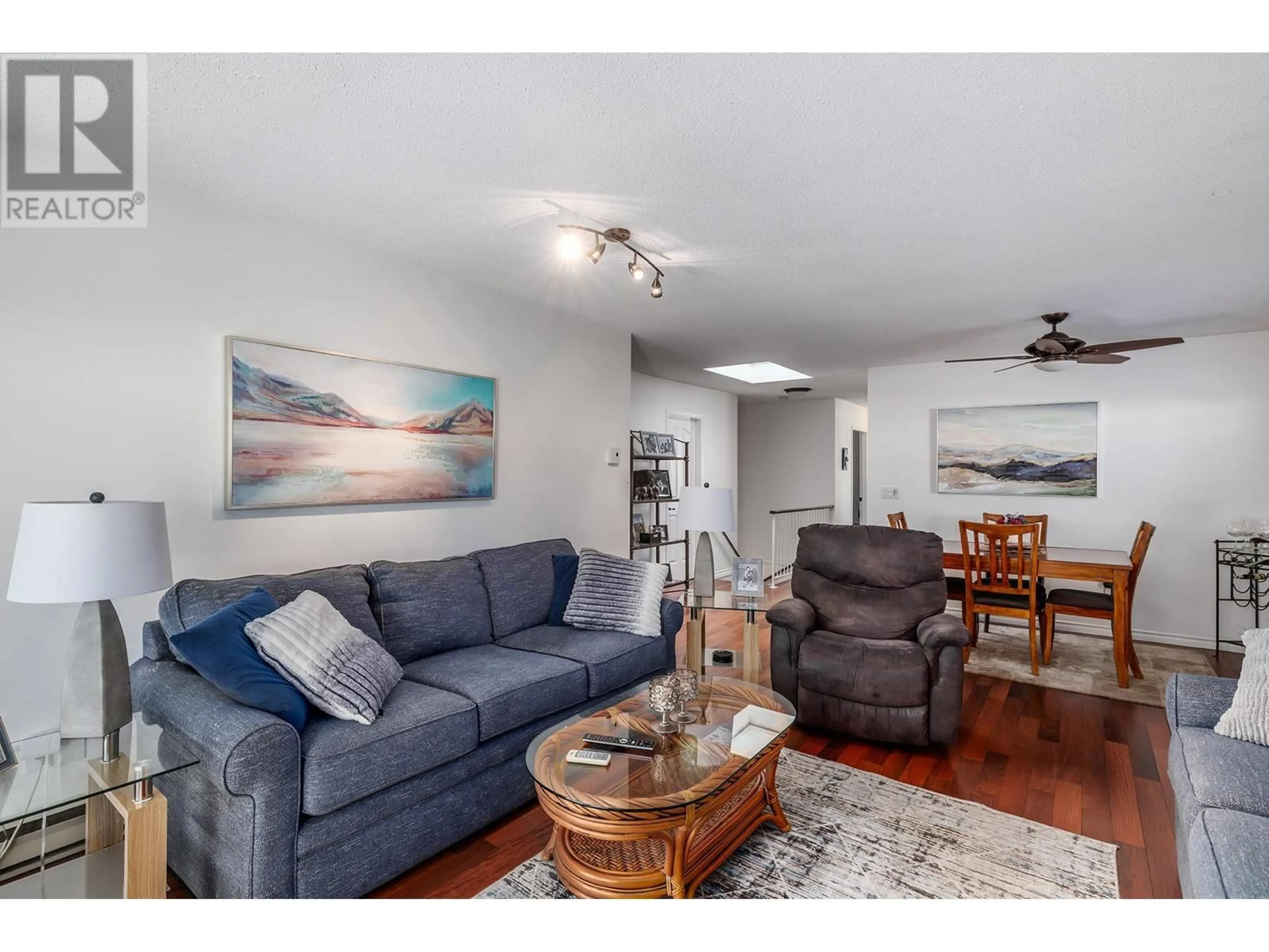 Living room with furniture, wood/laminate floor for 130 - 1765 LECKIE ROAD, Kelowna British Columbia V1X6X5