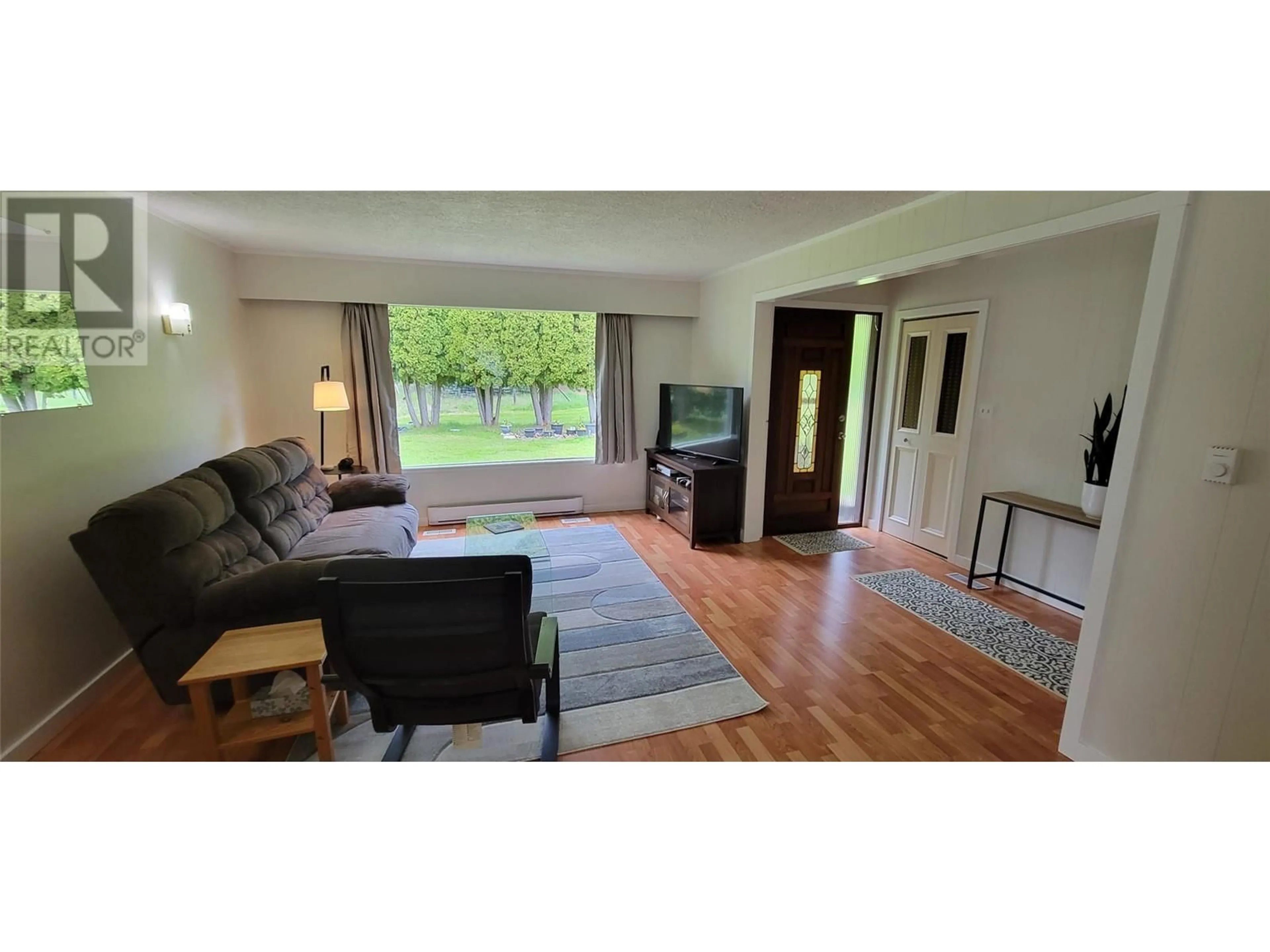Living room with furniture, wood/laminate floor for 6222 SLOCAN RIVER ROAD, Winlaw British Columbia V0G2J0