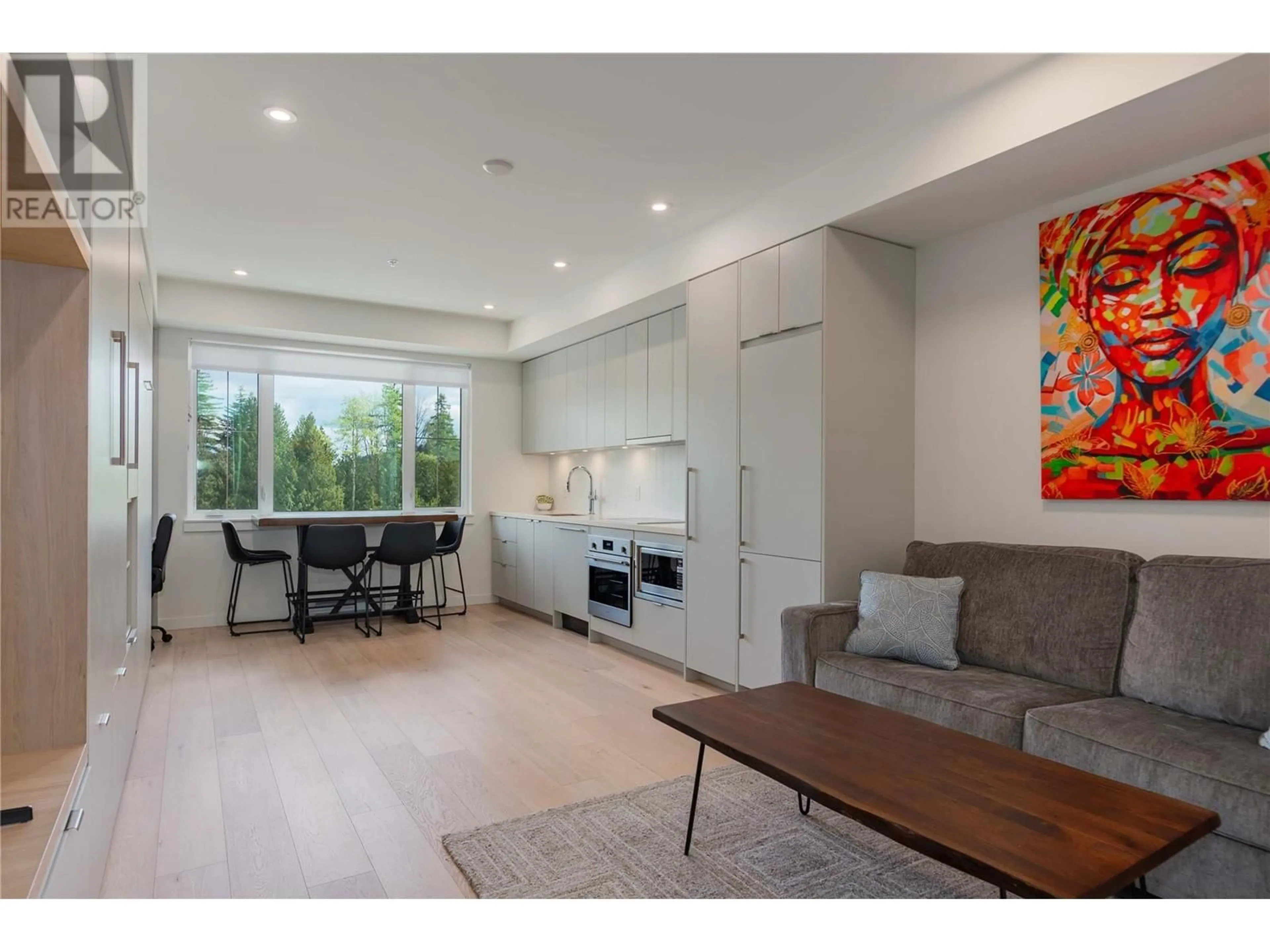 Open concept kitchen, wood/laminate floor for 115 - 4280 RED MOUNTAIN ROAD, Rossland British Columbia V0G1Y0