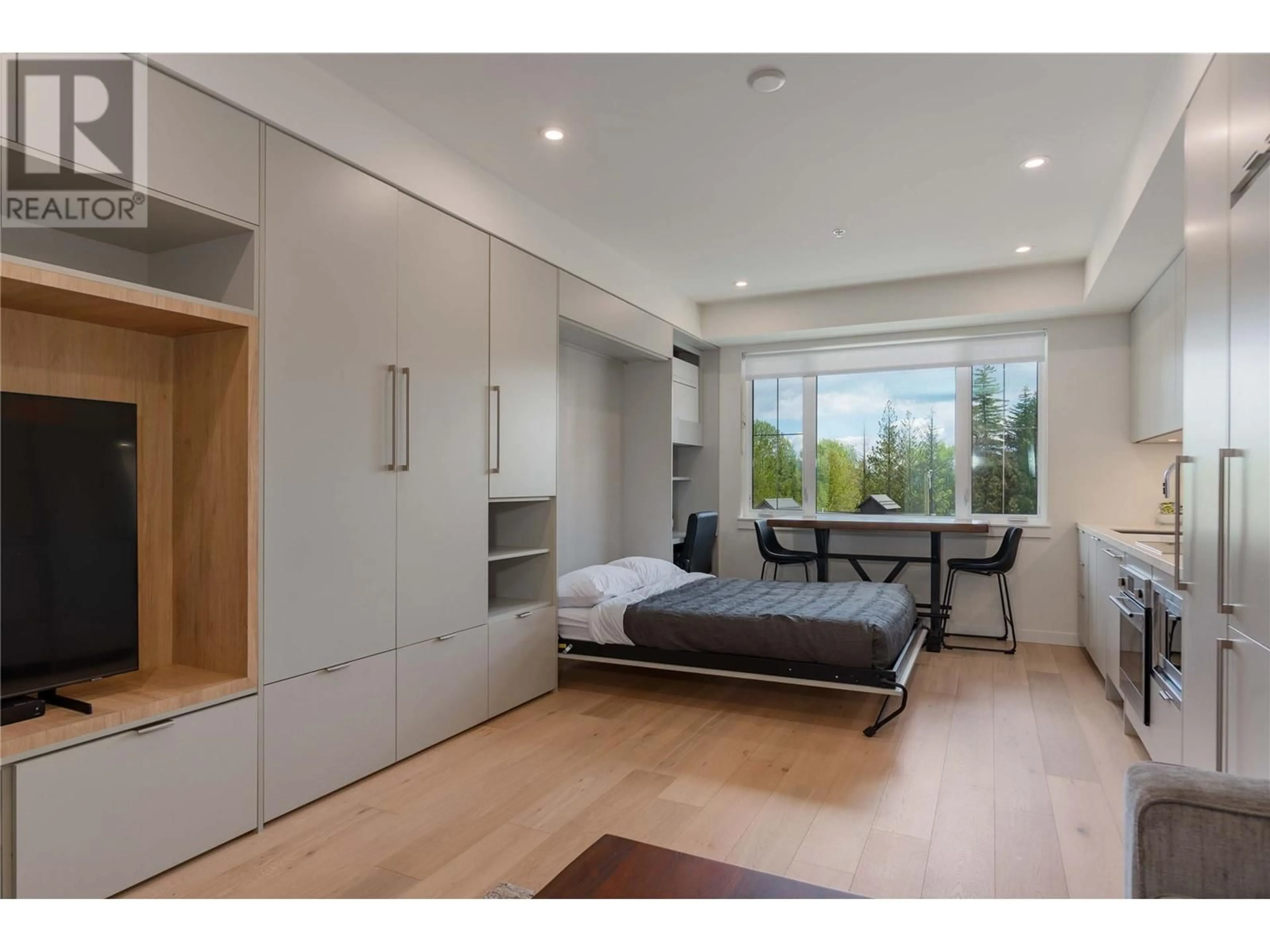 Bedroom with bed, wood/laminate floor for 115 - 4280 RED MOUNTAIN ROAD, Rossland British Columbia V0G1Y0