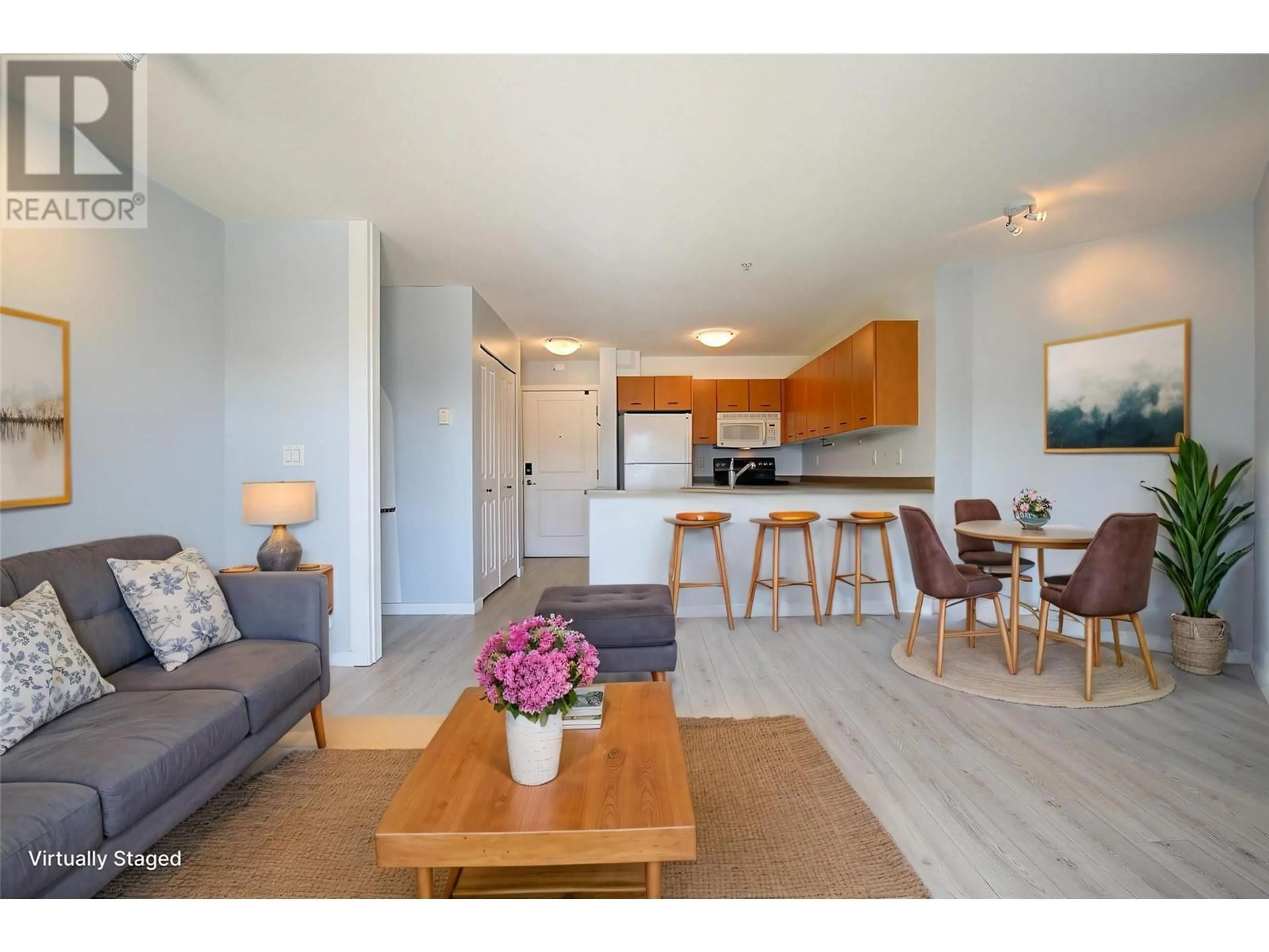 Living room with furniture, wood/laminate floor for 300 - 539 YATES ROAD, Kelowna British Columbia V1V2T8
