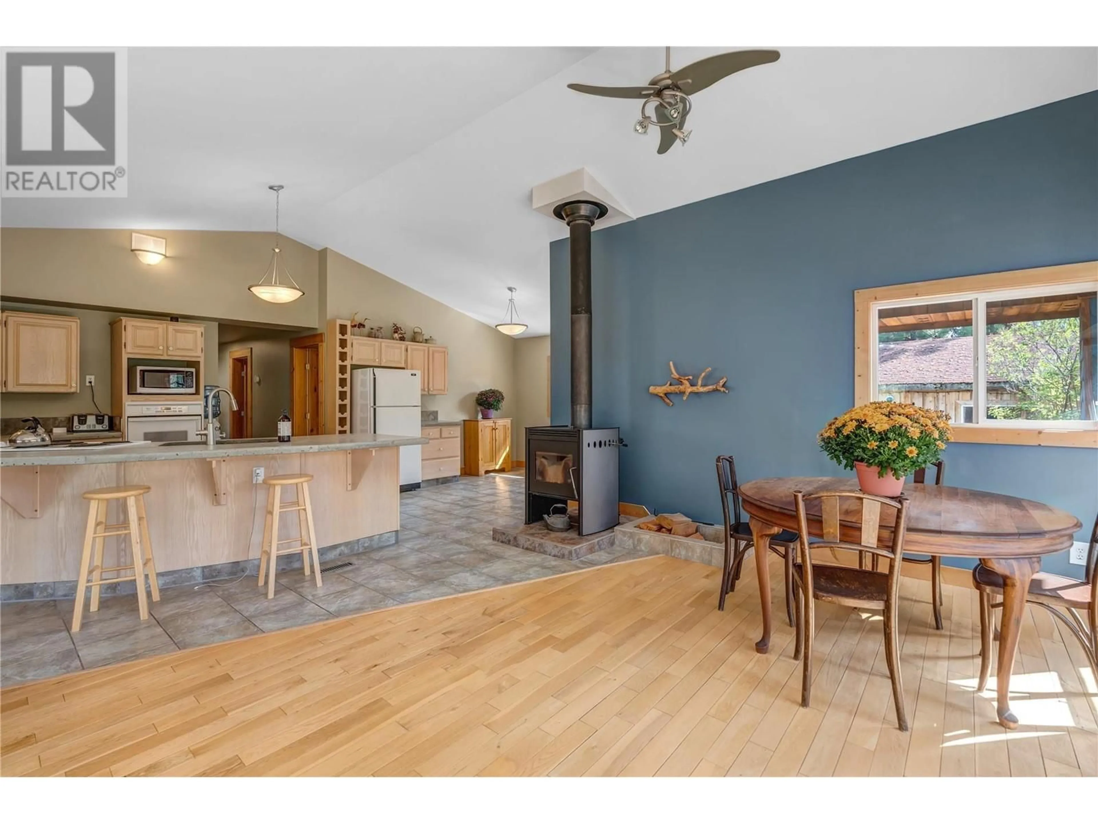 Open concept kitchen, wood/laminate floor for 28 DEANS ROAD, Summerland British Columbia V0H1Z8