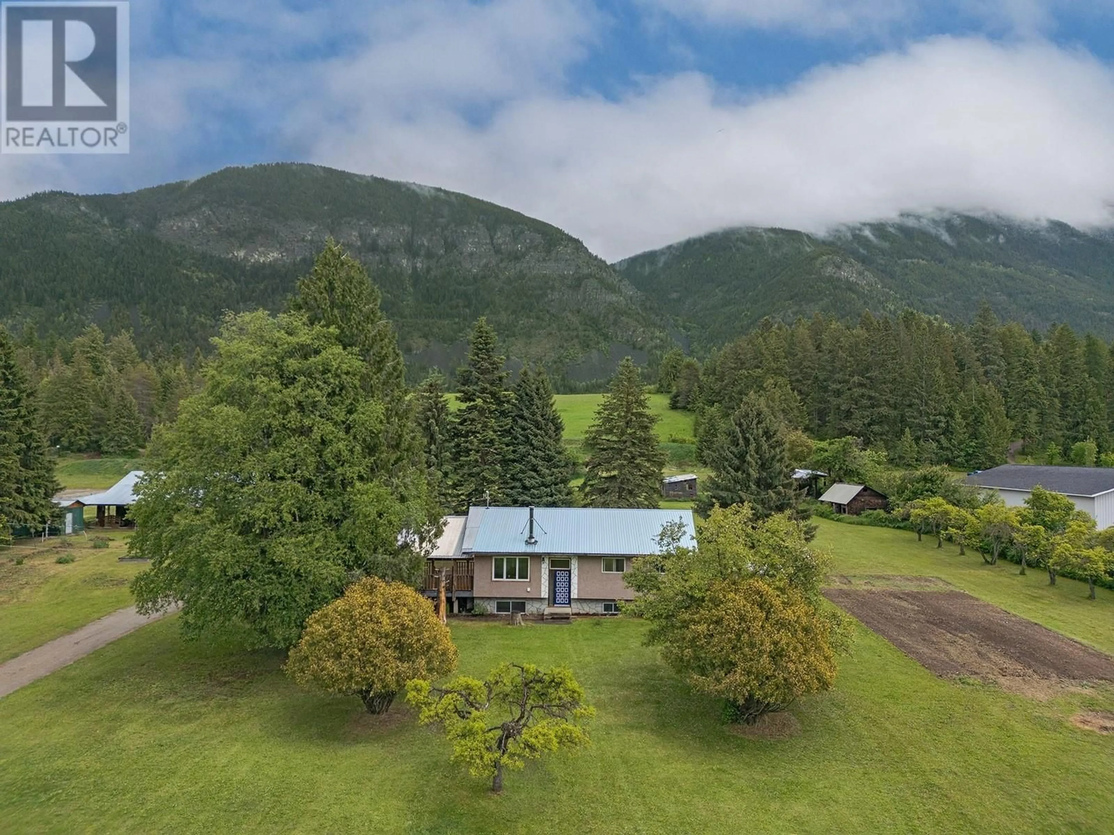 A pic from outside/outdoor area/front of a property/back of a property/a pic from drone, mountain view for 4670 CANYON LISTER ROAD, Canyon British Columbia V0B1C0