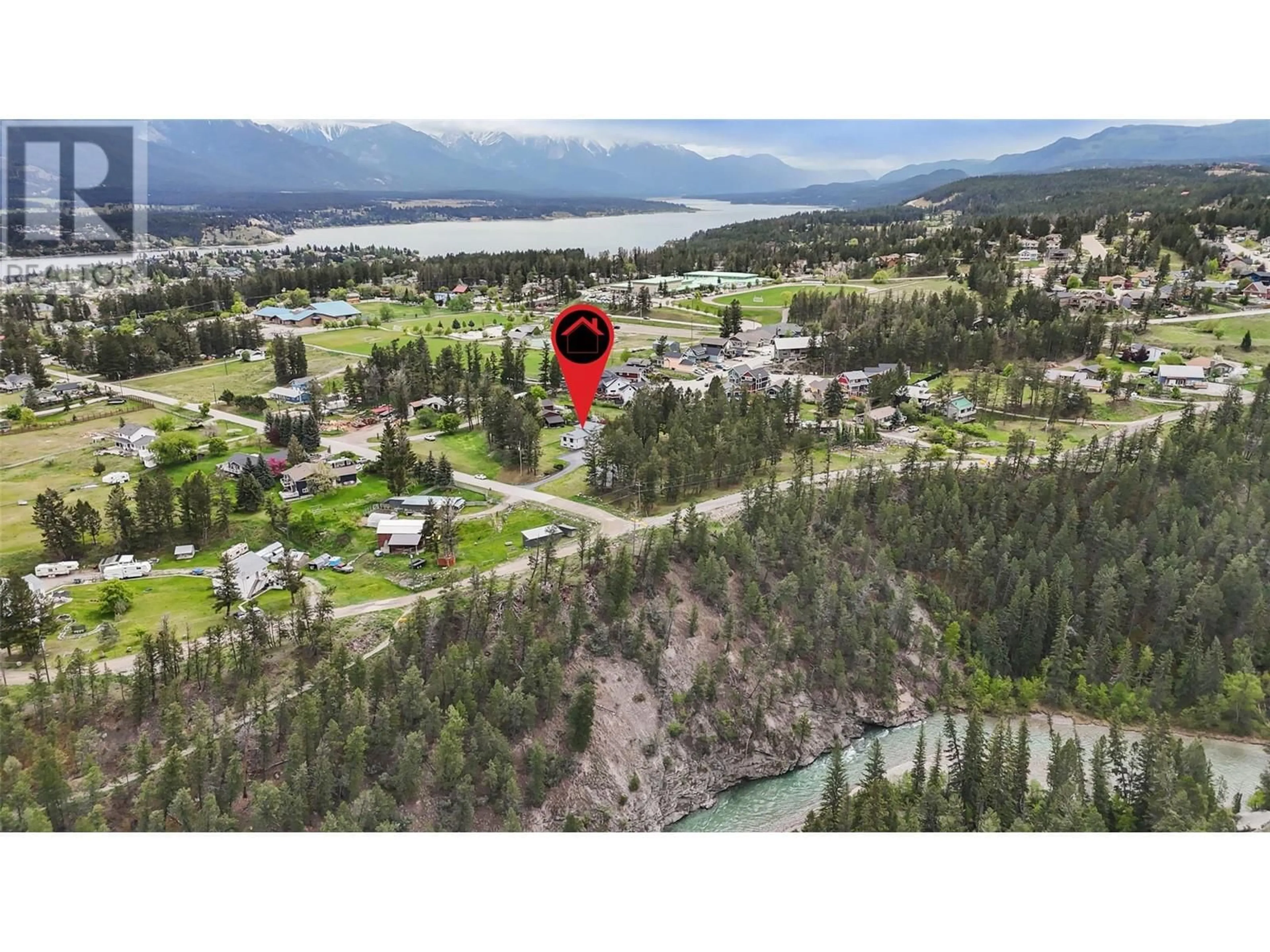 A pic from outside/outdoor area/front of a property/back of a property/a pic from drone, water/lake/river/ocean view for 1573 10 STREET, Invermere British Columbia V0A1K4