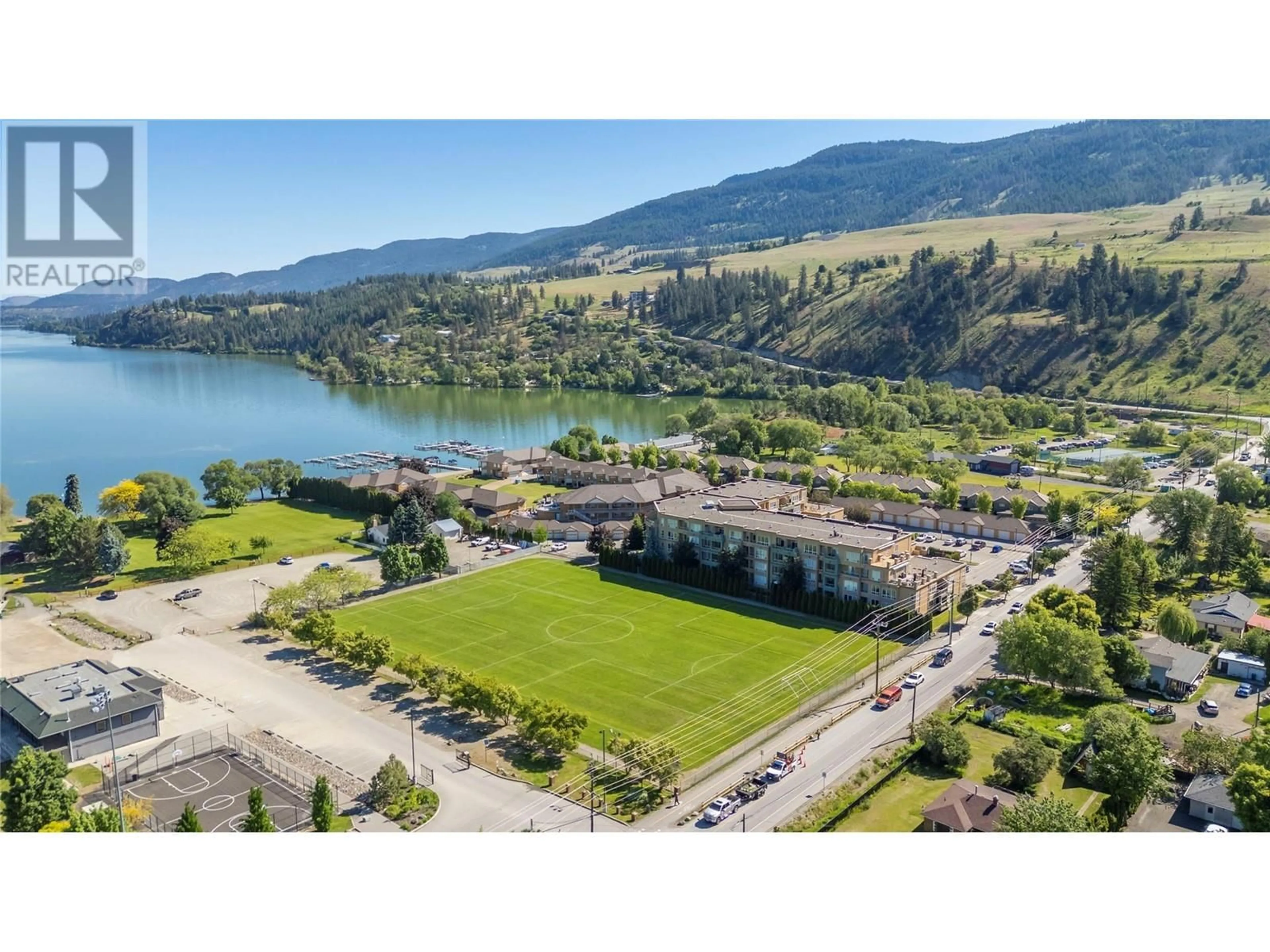 A pic from outside/outdoor area/front of a property/back of a property/a pic from drone, water/lake/river/ocean view for 212 - 3550 WOODSDALE ROAD, Lake Country British Columbia V4V2P5