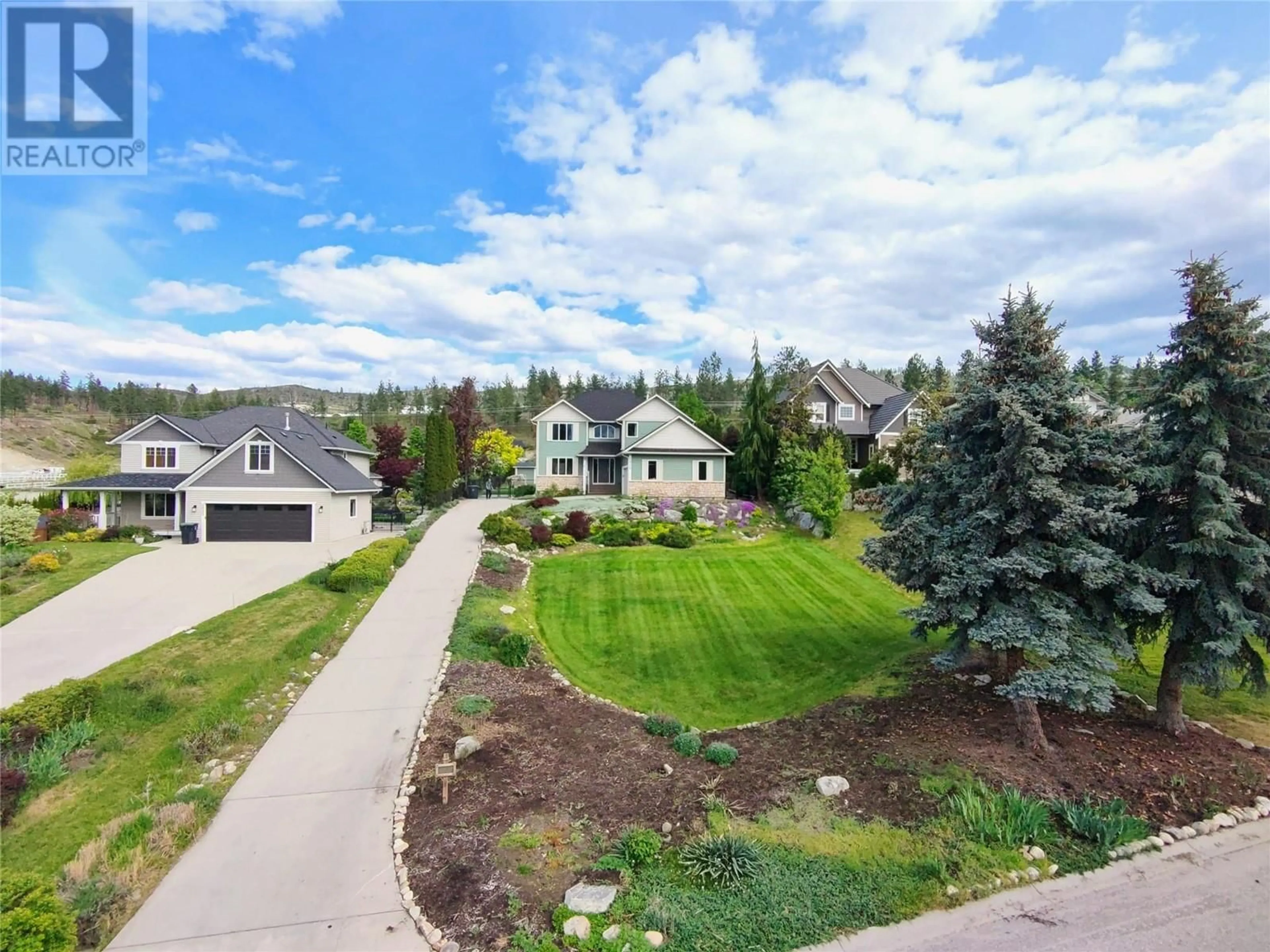 A pic from outside/outdoor area/front of a property/back of a property/a pic from drone, mountain view for 4849 CANYON RIDGE CRESCENT, Kelowna British Columbia V1W4A2