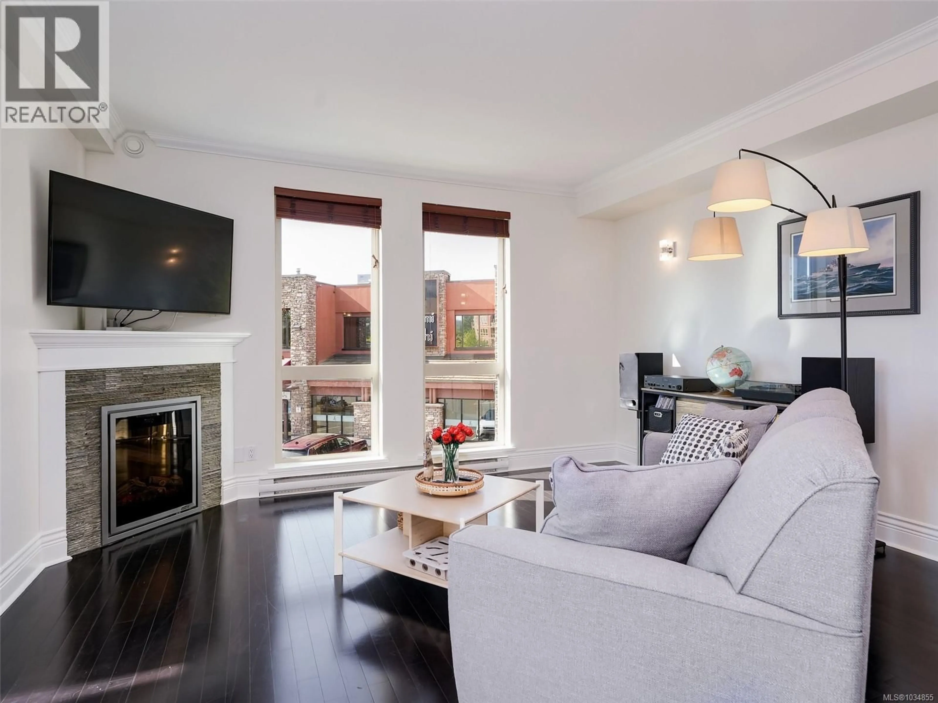 Living room with furniture, wood/laminate floor for 207 - 751 GOLDSTREAM AVENUE, Langford British Columbia V9B2X4