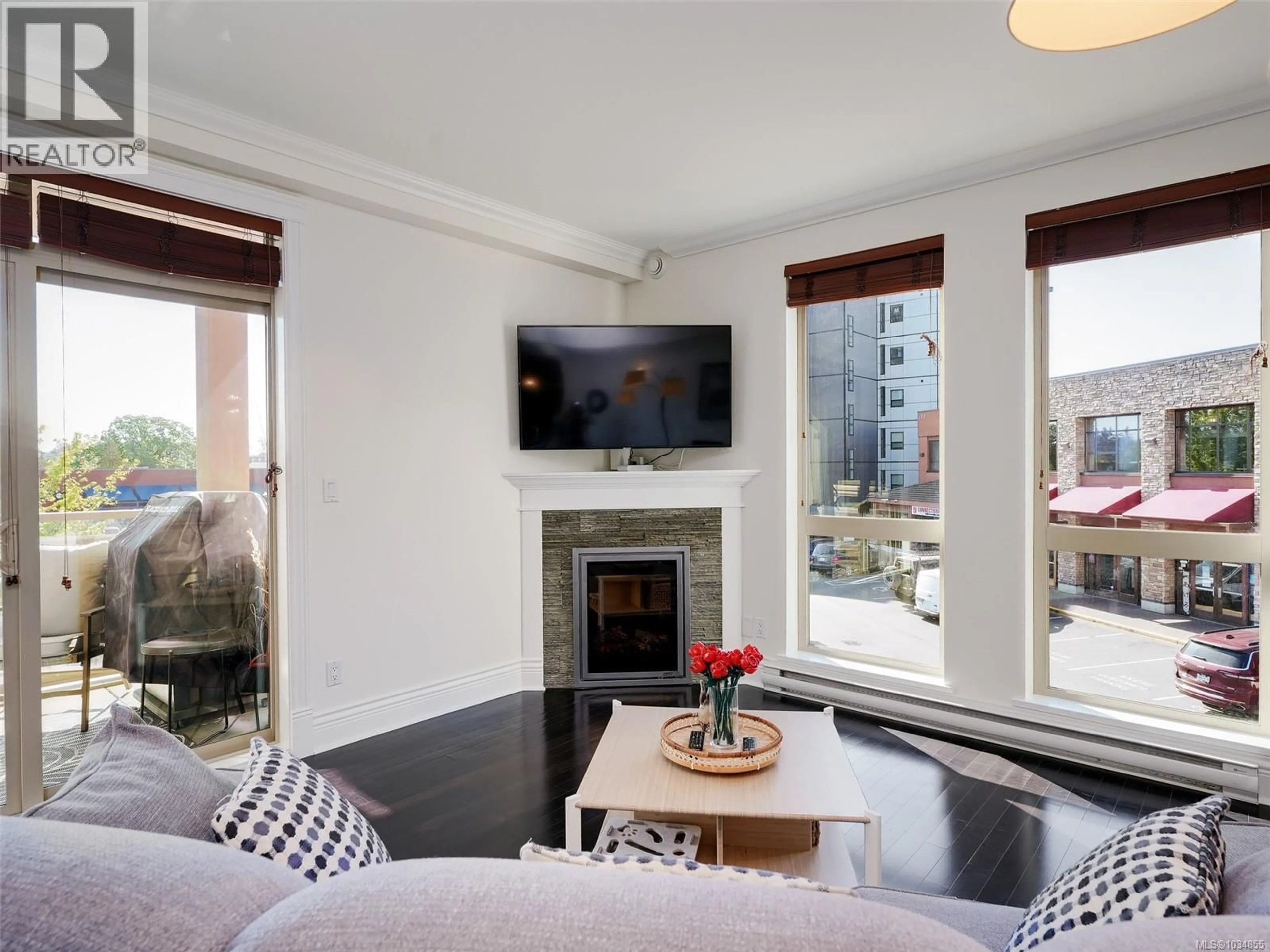 Living room with furniture, wood/laminate floor for 207 - 751 GOLDSTREAM AVENUE, Langford British Columbia V9B2X4