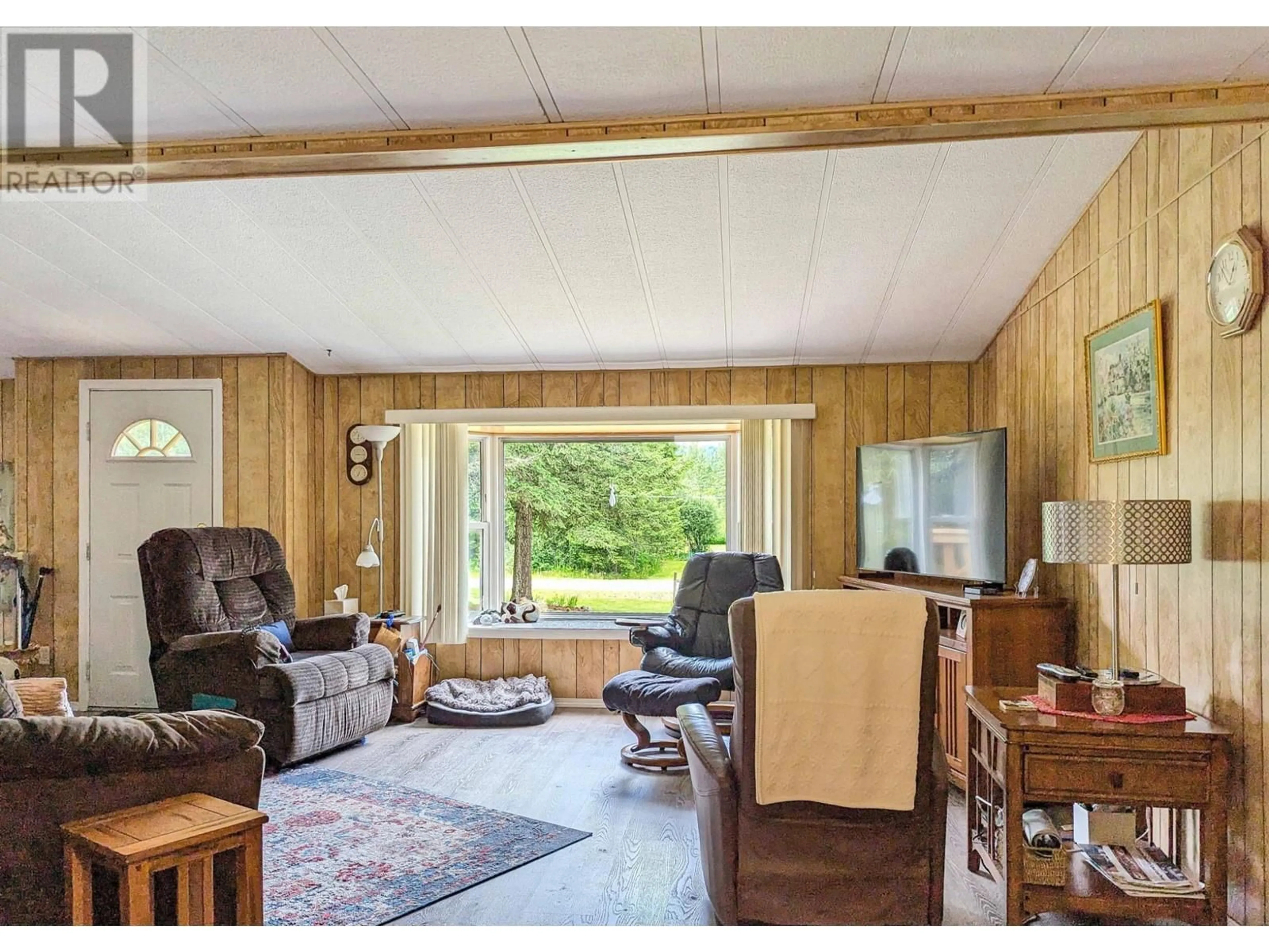Living room with furniture, wood/laminate floor for 1132 CAROLINE ROAD, Clearwater British Columbia V0E1N2