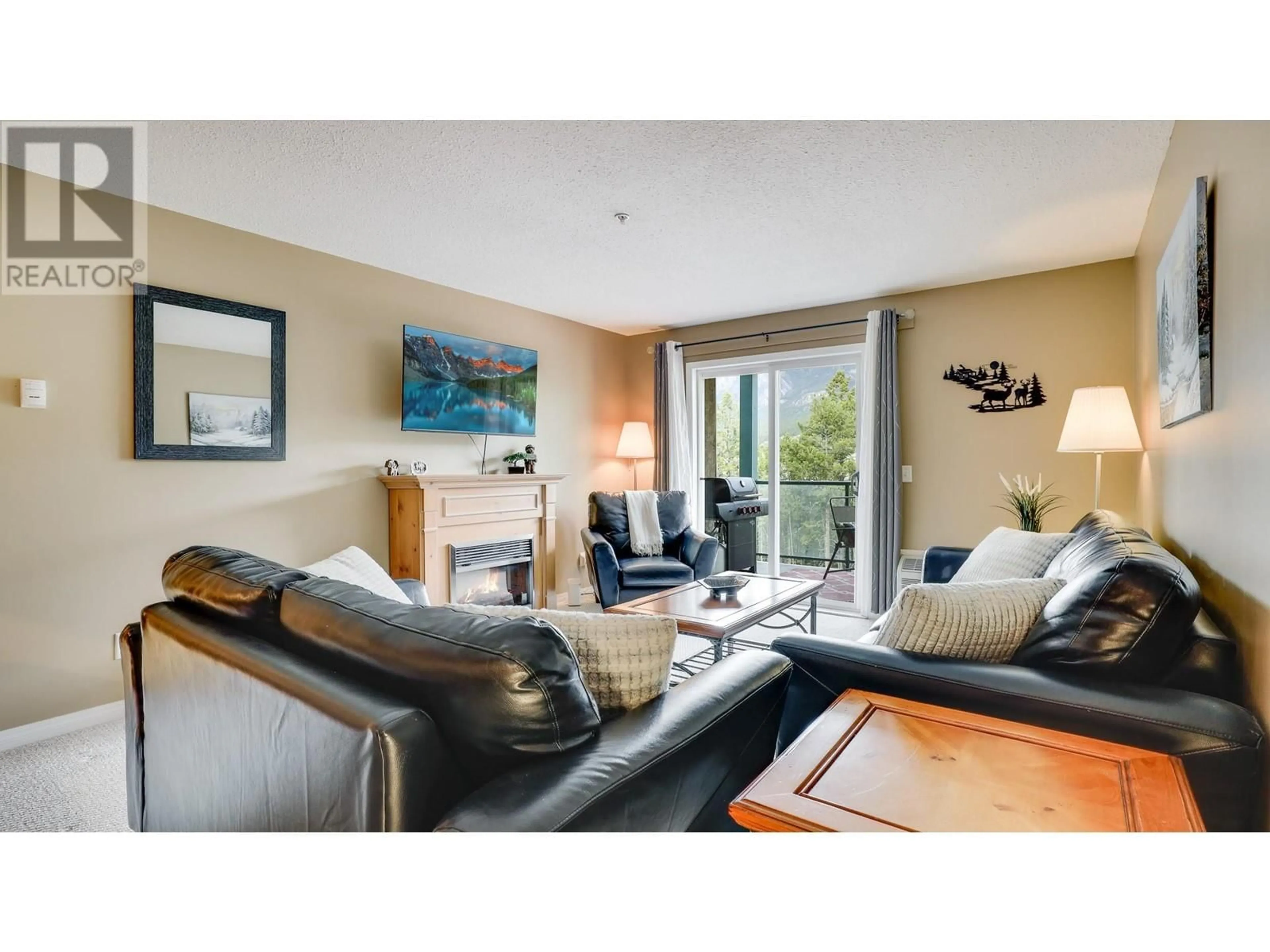 Living room with furniture, wood/laminate floor for 208 - 4769 FORSTERS LANDING ROAD, Radium Hot Springs British Columbia V0A1M0