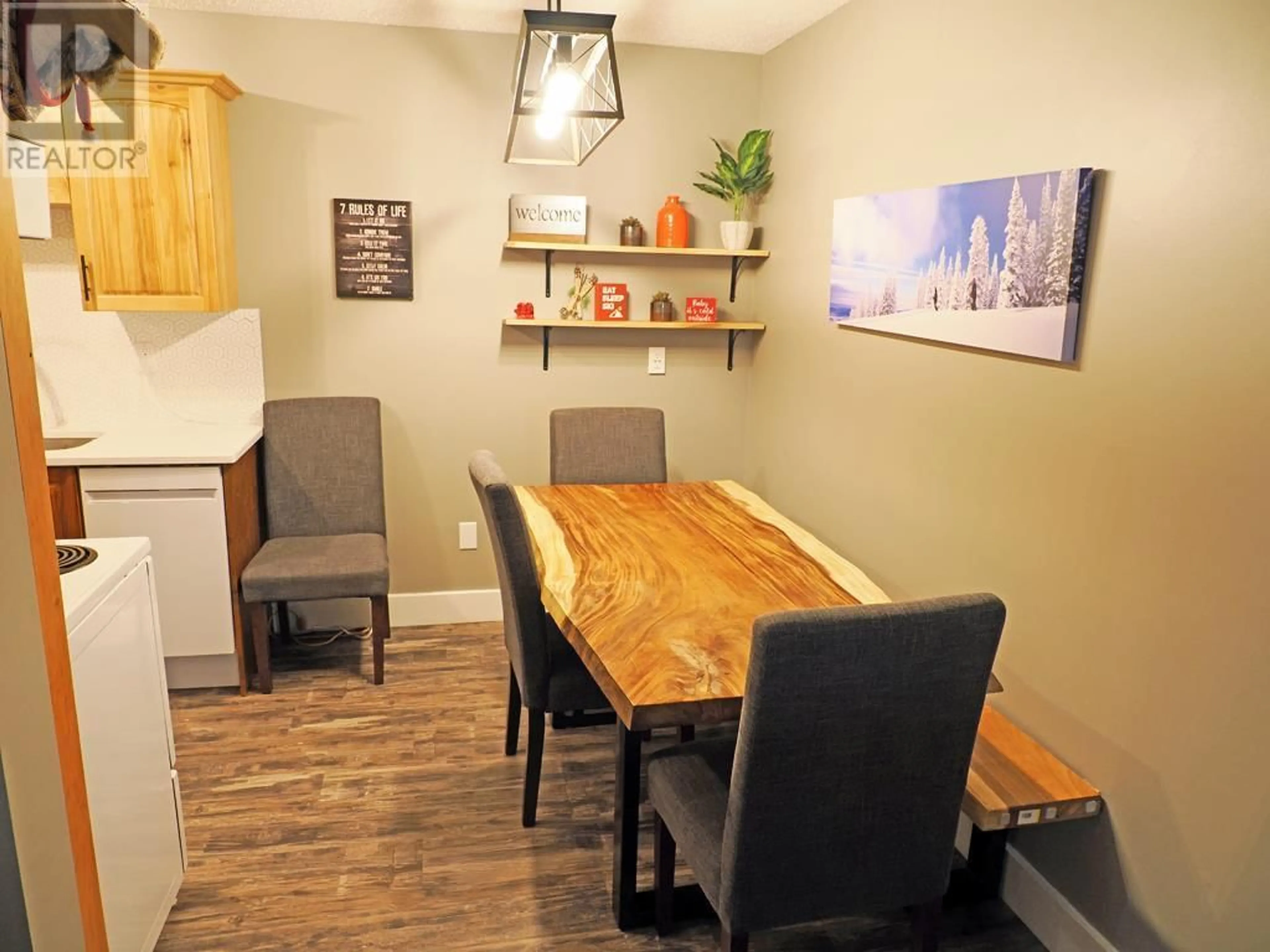 Dining room, wood/laminate floor for 310 - 6430 WHISKEY JACK ROAD, Big White British Columbia V1P1P3