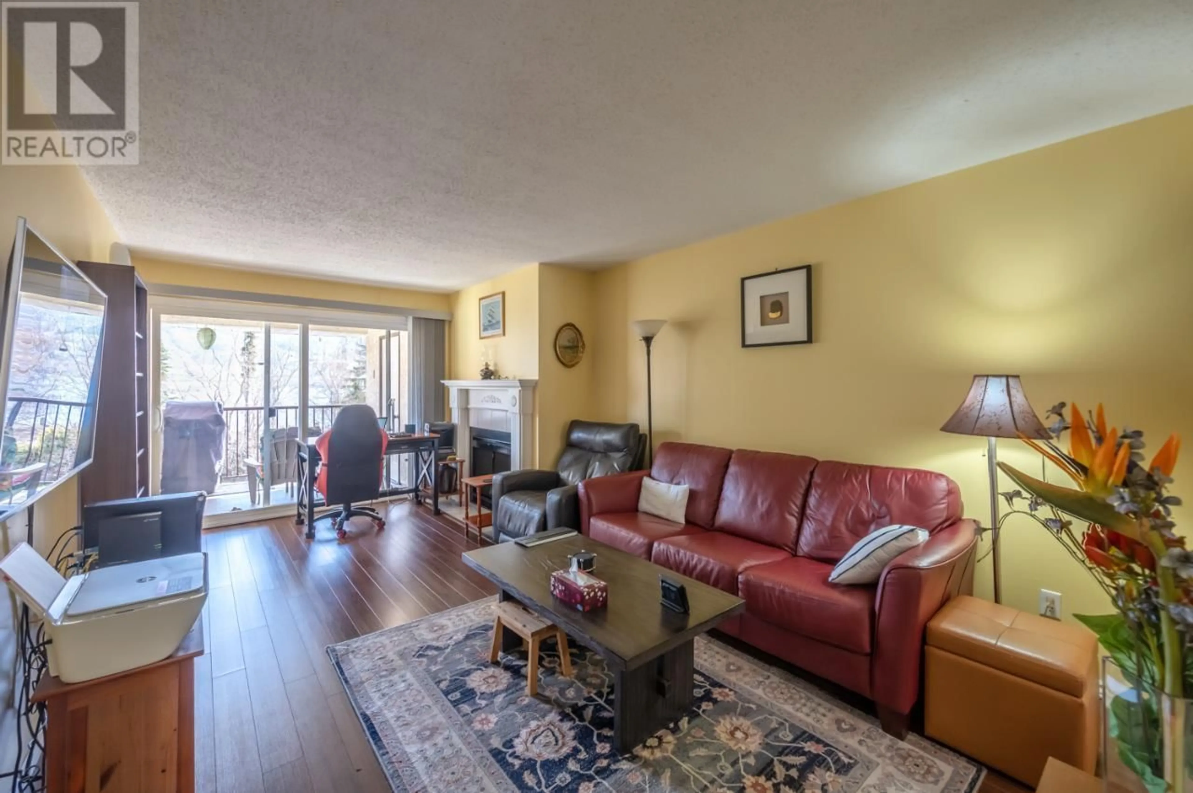 Living room with furniture, wood/laminate floor for 23 - 9107 62ND AVENUE, Osoyoos British Columbia V0H1V1