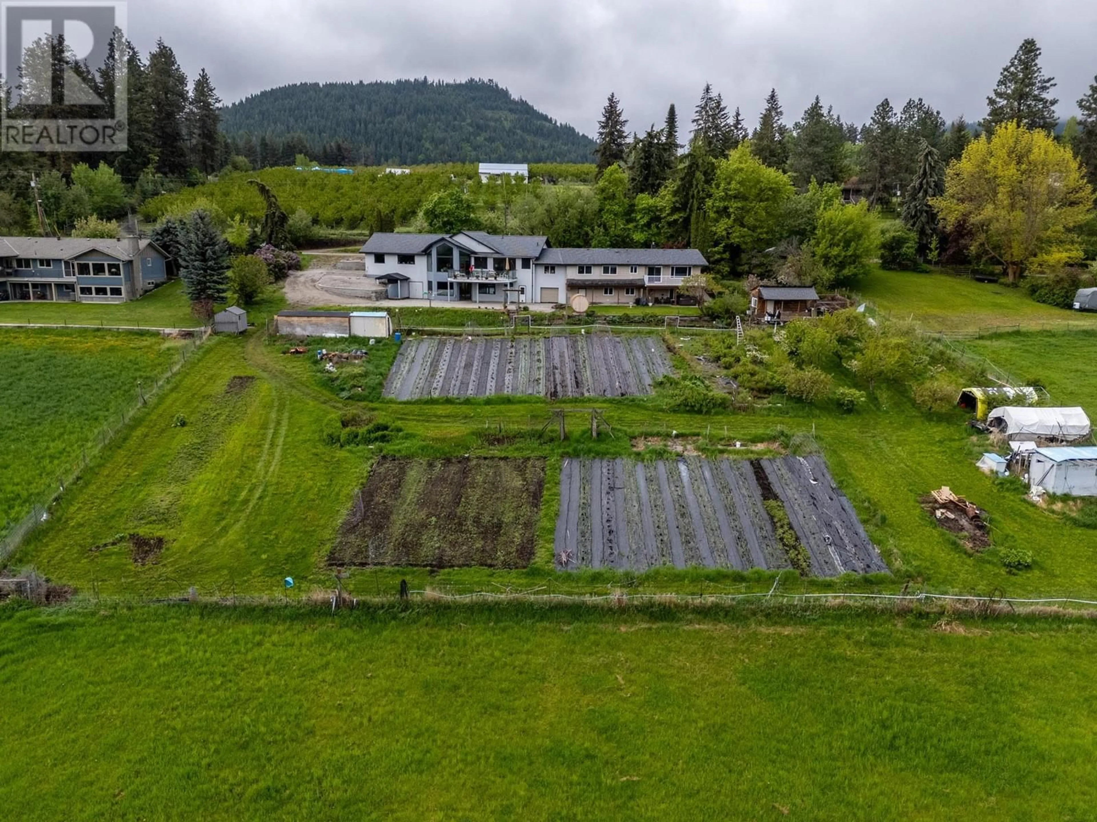 A pic from outside/outdoor area/front of a property/back of a property/a pic from drone, water/lake/river/ocean view for 5585 REID ROAD, Coldstream British Columbia V1B3E8