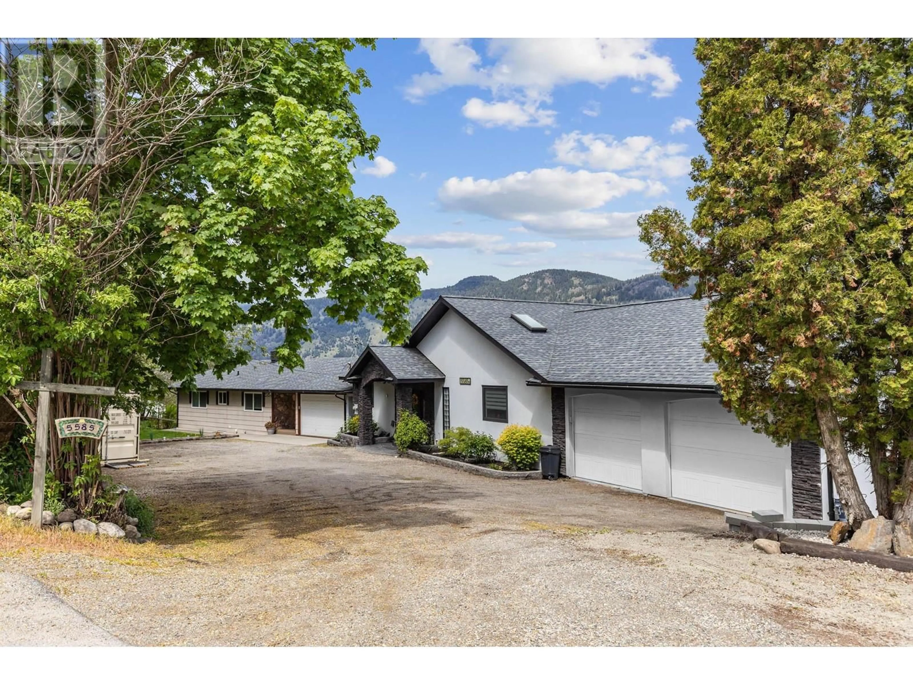 A pic from outside/outdoor area/front of a property/back of a property/a pic from drone, mountain view for 5585 REID ROAD, Coldstream British Columbia V1B3E8