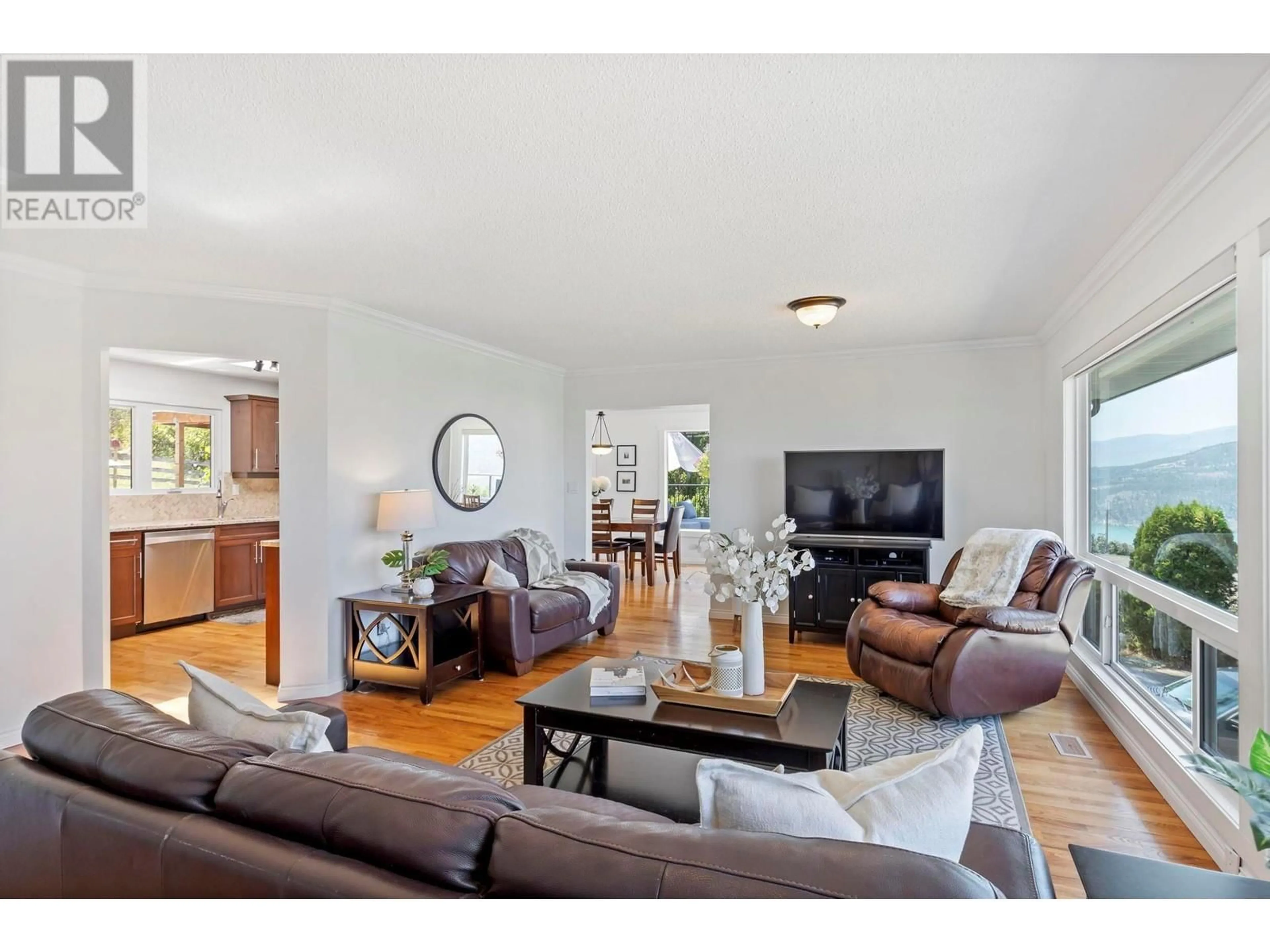 Living room with furniture, wood/laminate floor for 14251 EAST HILL ROAD, Lake Country British Columbia V4V2B9
