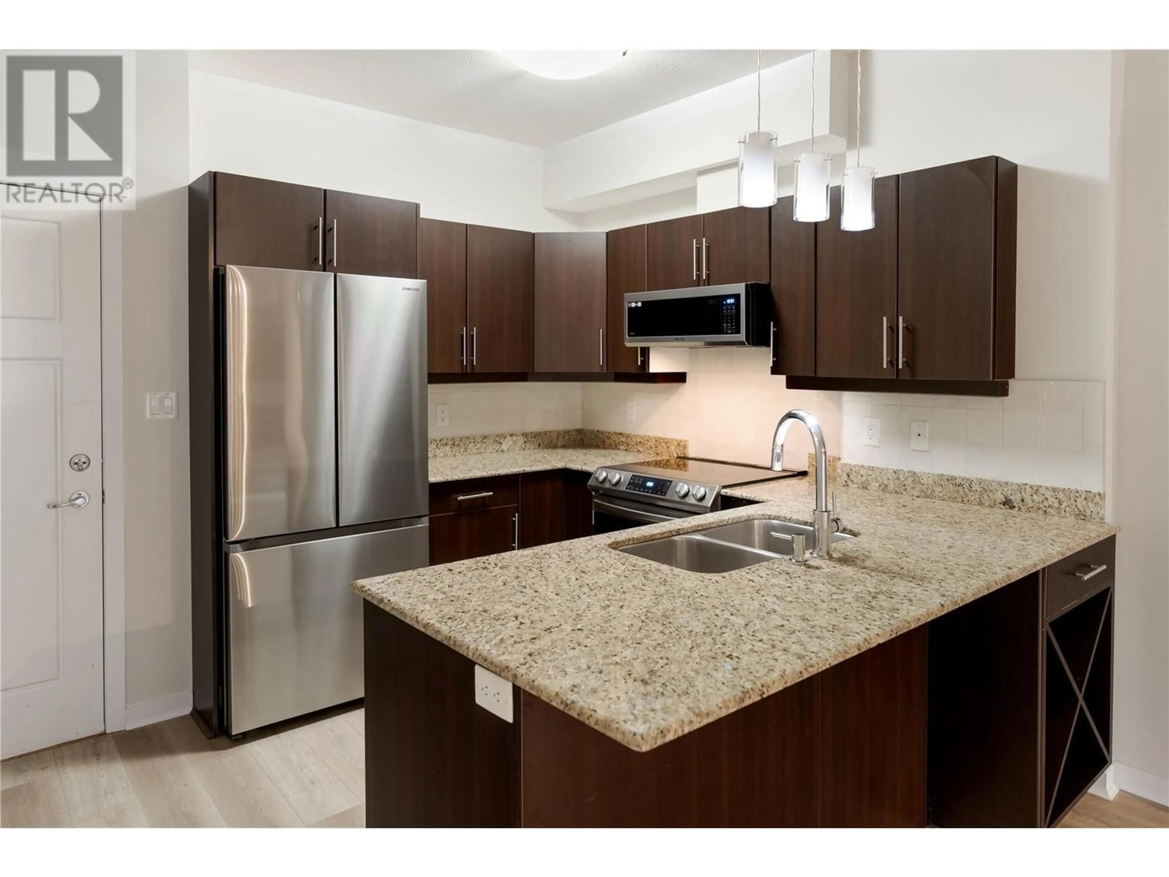 Standard kitchen, ceramic/tile floor for 101 - 1957 KANE ROAD, Kelowna British Columbia V1V2X7